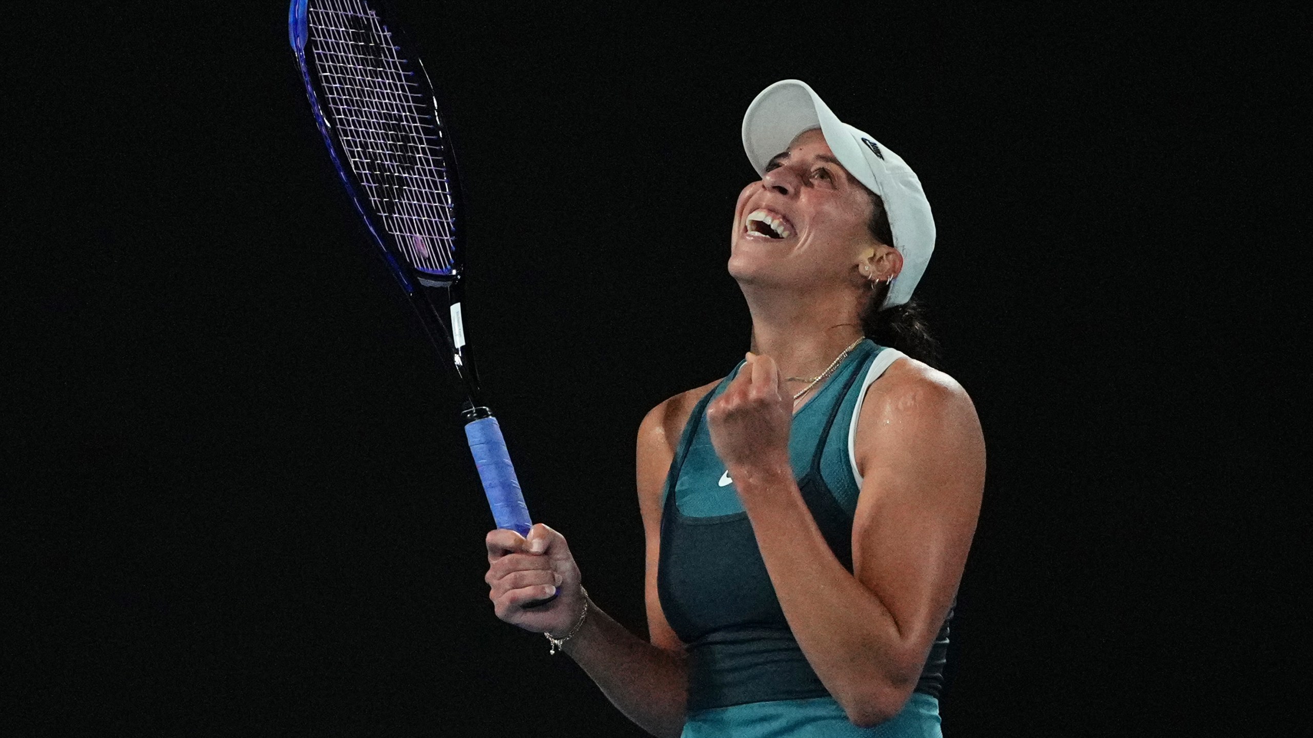 Madison Keys of the U.S. celebrates after defeating Iga Swiatek of Poland in their semifinal match at the Australian Open tennis championship in Melbourne, Australia, early Friday, Jan. 24, 2025. (AP Photo/Vincent Thian)