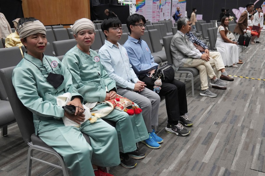 A couple from the LGBTQ+ community wait to sign their marriage certificates as the Marriage Equality Act takes effect in Bangkok, Thailand, Thursday, Jan. 23, 2025. (AP Photo/Sakchai Lalit)