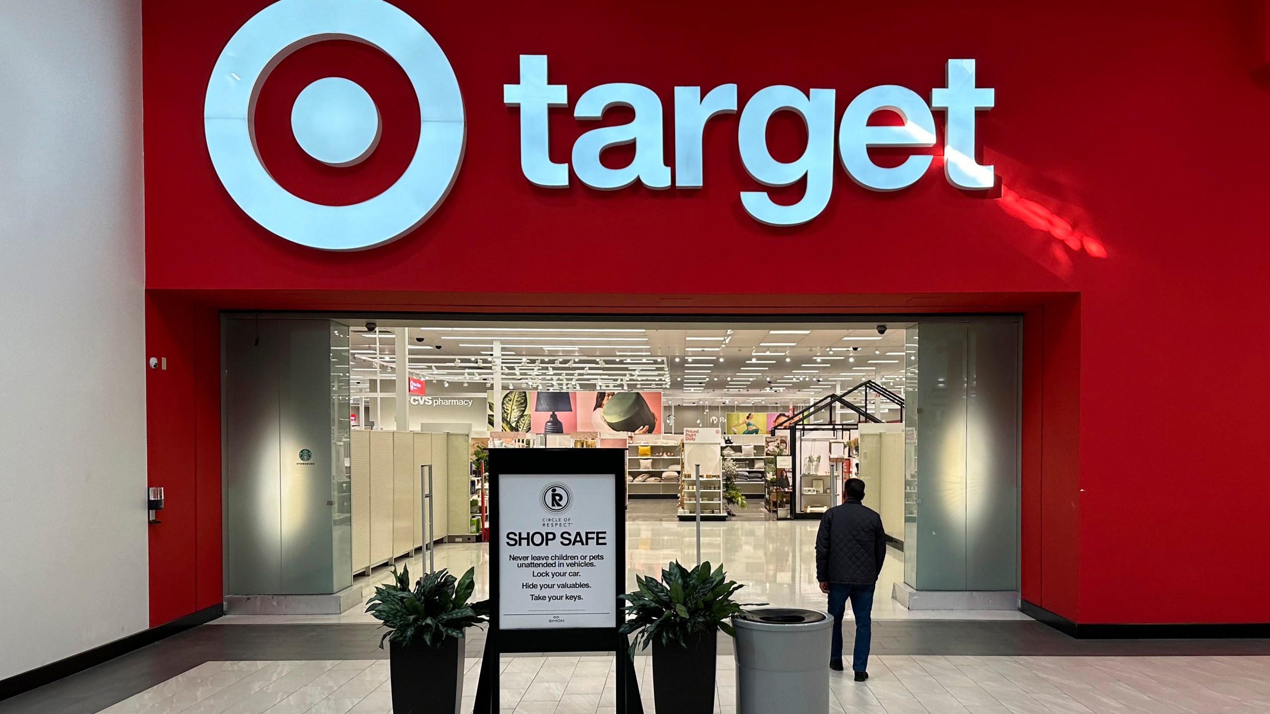 FILE - A person heads into a Target store Thursday, Jan. 11, 2024, in Lakewood, Colo. (AP Photo/David Zalubowski, File)