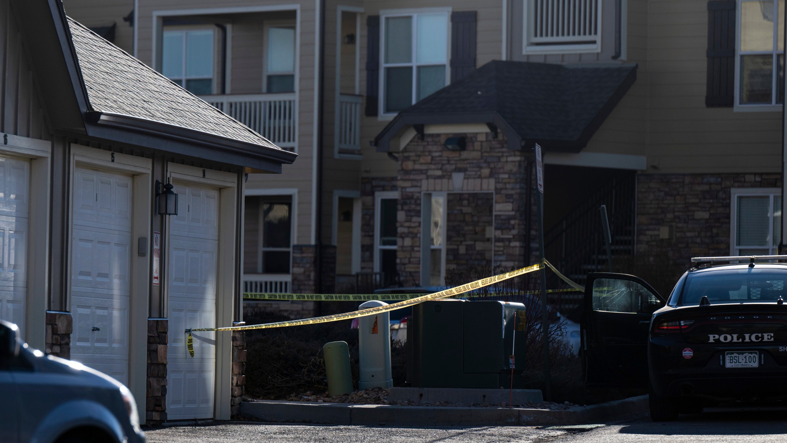 FILE - Police tape marks a crime scene where Colorado Springs police found children dead inside a condo of the Palomino Ranch Point complex after responding to a 911 call reporting a burglary on Tuesday, Dec. 19, 2023 in Colorado Springs, Colo. (Parker Seibold /The Gazette via AP, File)