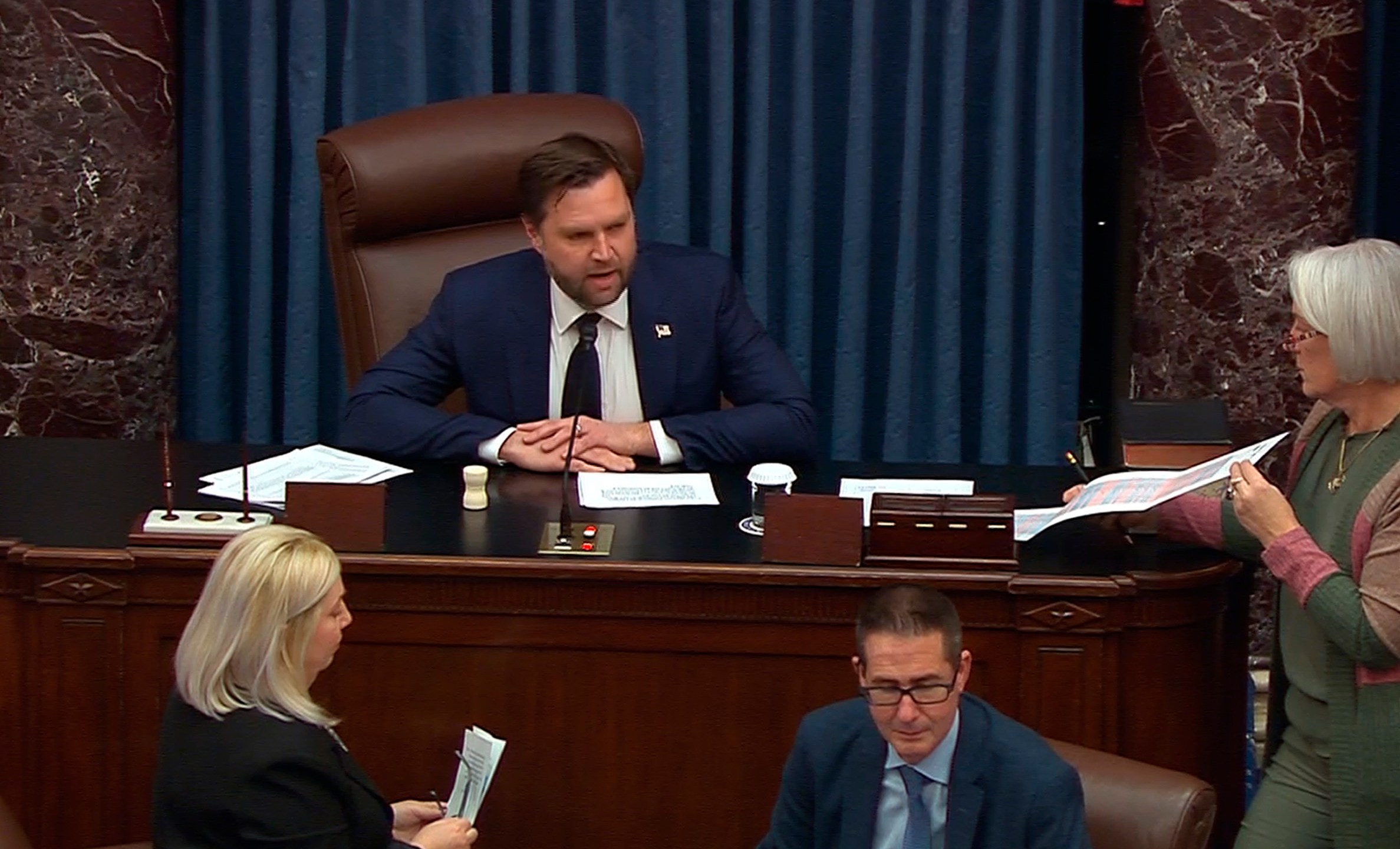 In this image provided by Senate Television, Vice President JD Vance casts the tie-breaking vote to confirm Pete Hegseth as President Donald Trump's choice for defense secretary, Friday, Jan. 24, 2025, at the Capitol in Washington. (Senate Television via AP)