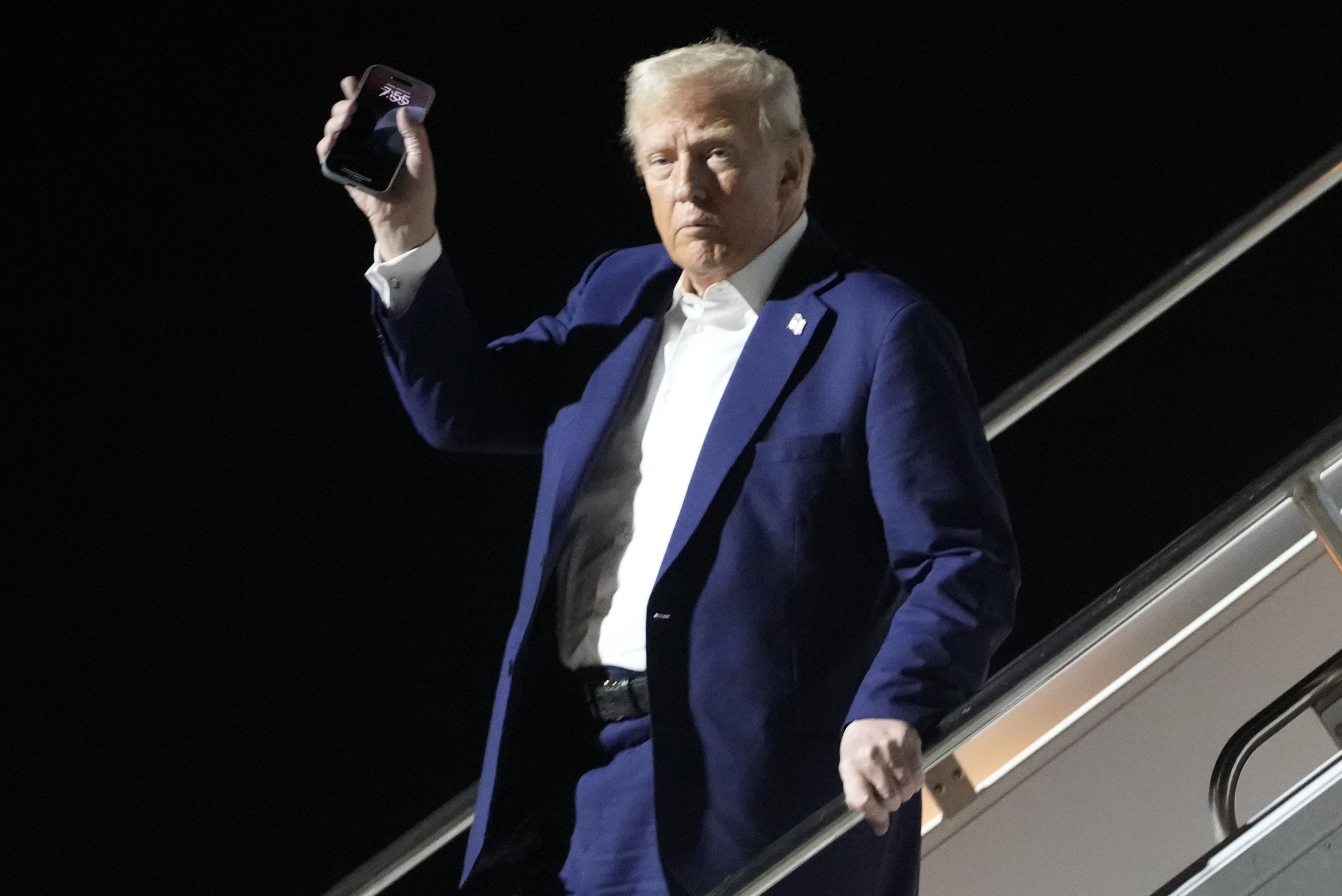 President Donald Trump arrives on Air Force One at Harry Reid International Airport in Las Vegas, Friday, Jan. 24, 2025. (AP Photo/Mark Schiefelbein)