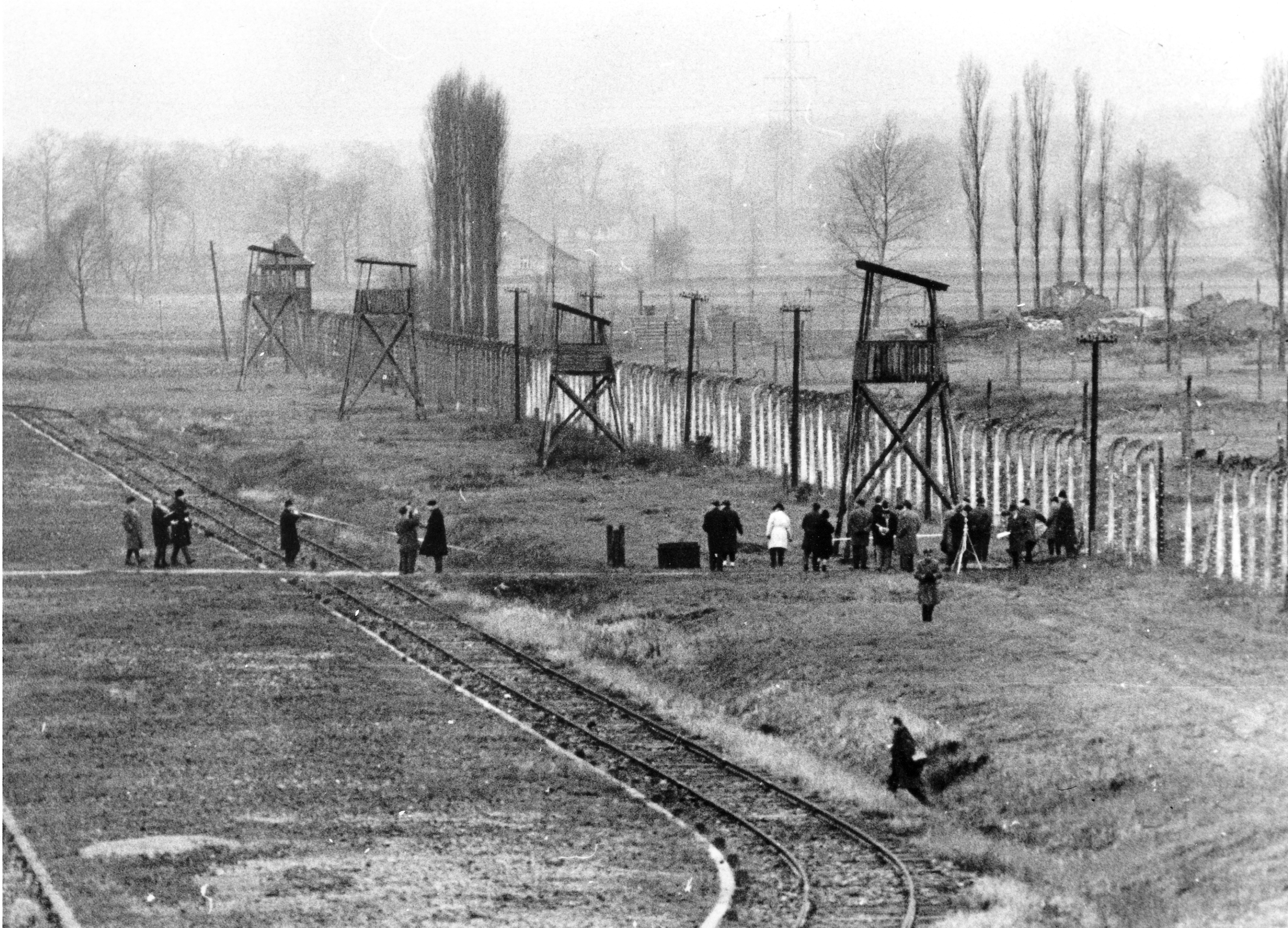 CAPTION CORRECTS INFO FILE - Part of the Auschwitz war crimes court inspects the former Nazi extermination center in Poland in Dec. 1964, where around 1.1 million mostly Jews, perished during World War II, from 1940 until 1945. (AP Photo, File)