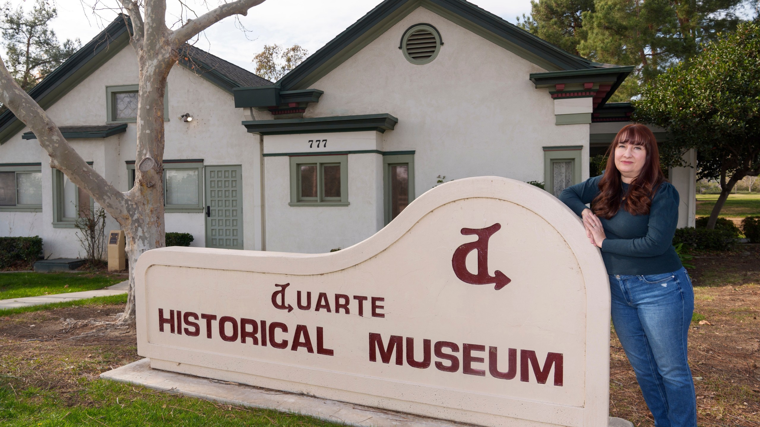 Resident Cici Carroll poses for a photo outside the Duarte Historical Museum in Duarte, Calif., Friday, Jan. 31, 2025, as she expresses her concerns regarding the proximity of Lario Park, in the vicinity of Irwindale, used by the U.S. Environmental Protection Agency (EPA), as a temporary site for processing hazardous materials from the Eaton Fire. (AP Photo/Damian Dovarganes)