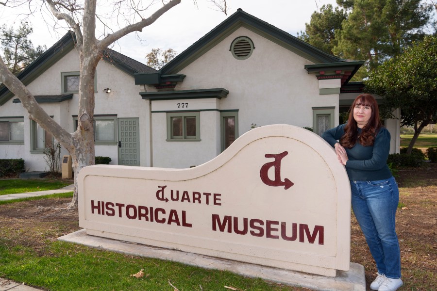 Resident Cici Carroll poses for a photo outside the Duarte Historical Museum in Duarte, Calif., Friday, Jan. 31, 2025, as she expresses her concerns regarding the proximity of Lario Park, in the vicinity of Irwindale, used by the U.S. Environmental Protection Agency (EPA), as a temporary site for processing hazardous materials from the Eaton Fire. (AP Photo/Damian Dovarganes)