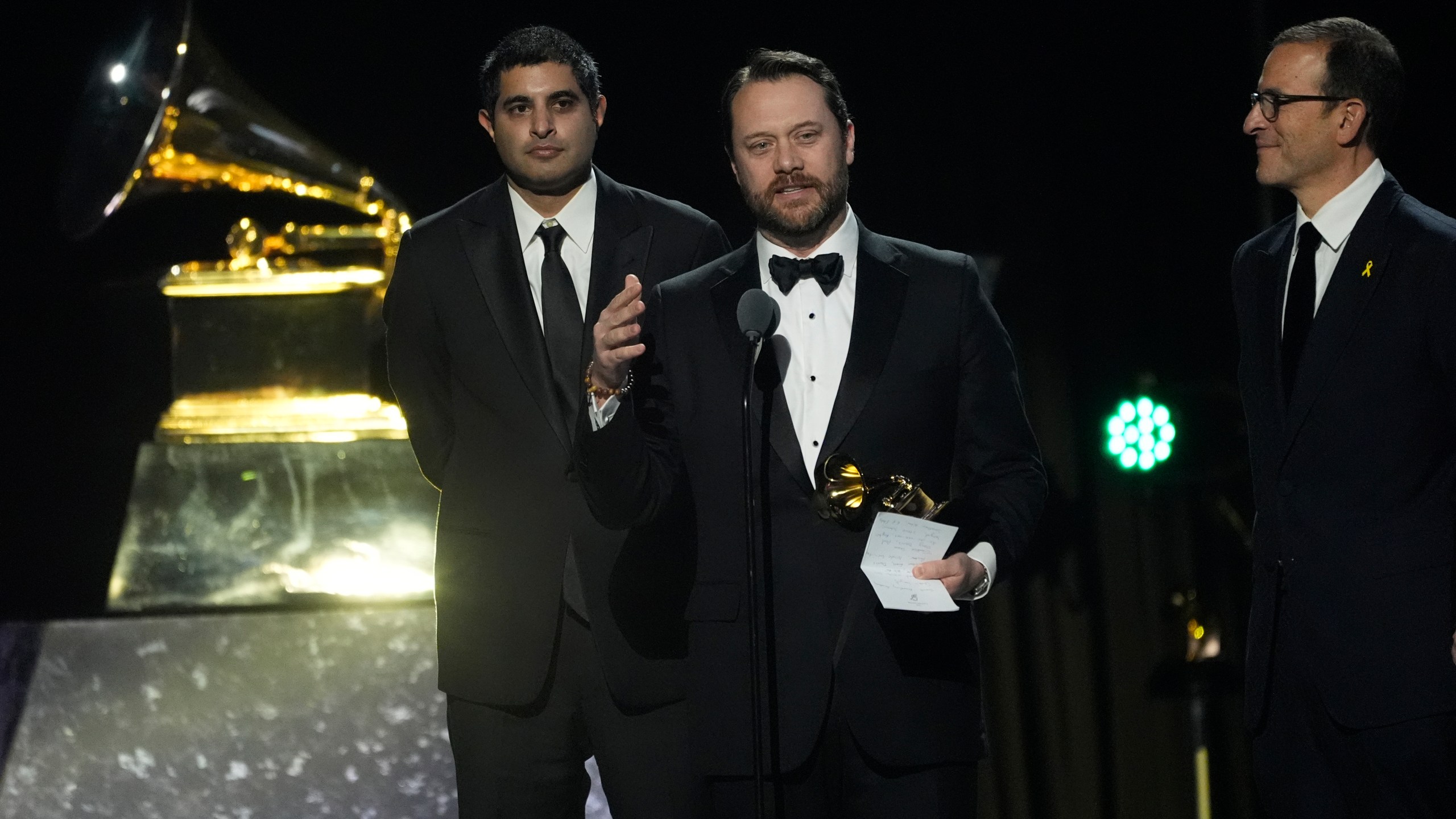 Kabir Sehgal, left, and Jason Carter accepts the award for best audiobook, narration, and storytelling recording for "Last Sundays in Plains: A Centennial Celebration" during the 67th annual Grammy Awards on Sunday, Feb. 2, 2025, in Los Angeles. (AP Photo/Chris Pizzello)