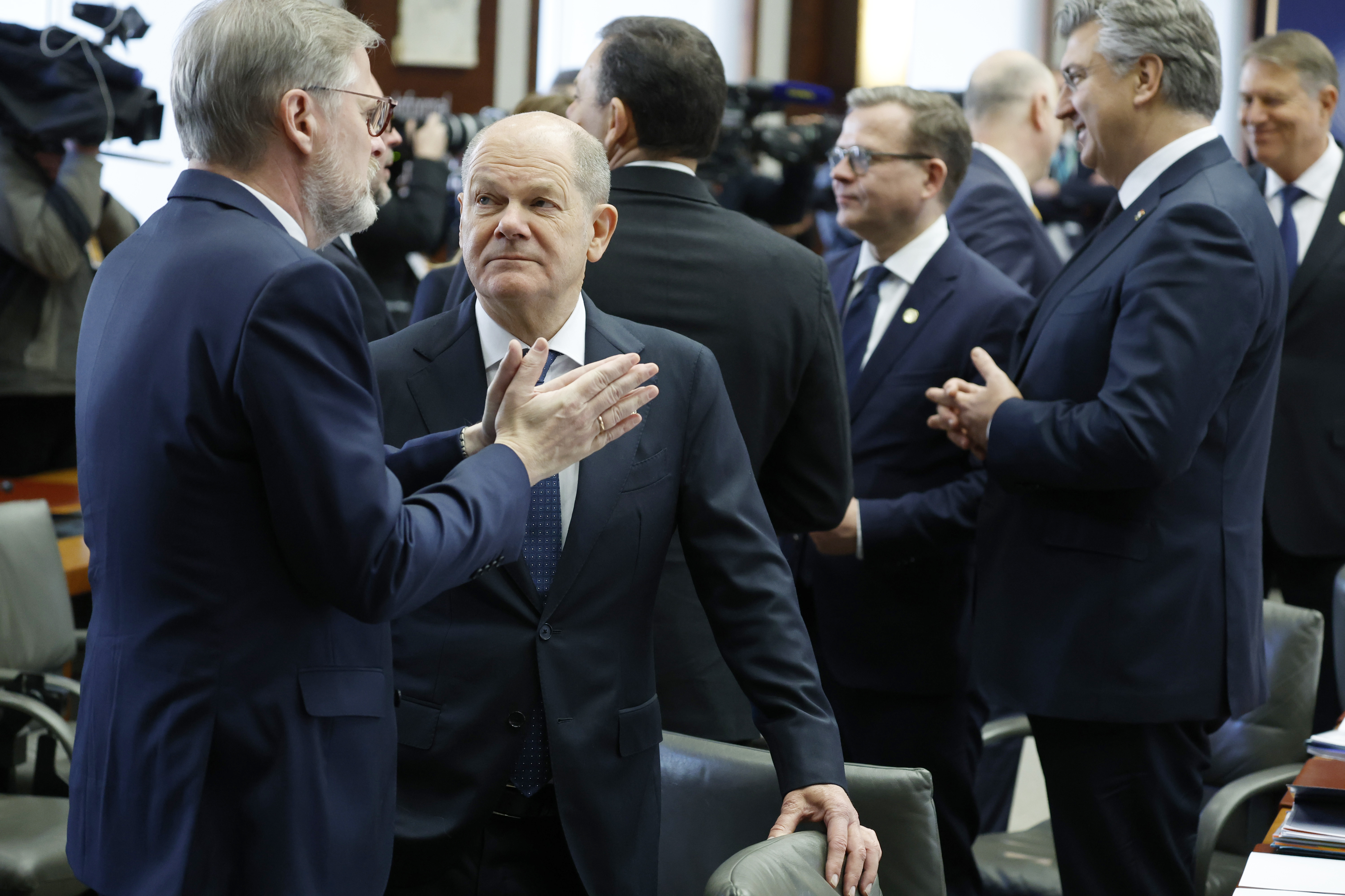 Germany's Chancellor Olaf Scholz, second left, speaks with Czech Republic's Prime Minister Petr Fiala, left, at a round table meeting during an EU summit in Brussels, Monday, Feb. 3, 2025. (AP Photo/Geert Vanden Wijngaert)