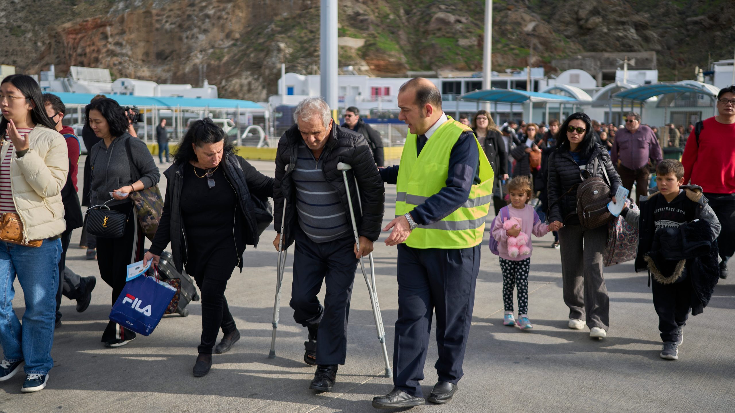 Passengers board a regularly scheduled ferry to Athens' port of Piraeus, after a spike in seismic activity raised concerns about a potentially powerful earthquake in Santorini, southern Greece, Monday, Feb. 3, 2025. (AP Photo/Petros Giannakouris)