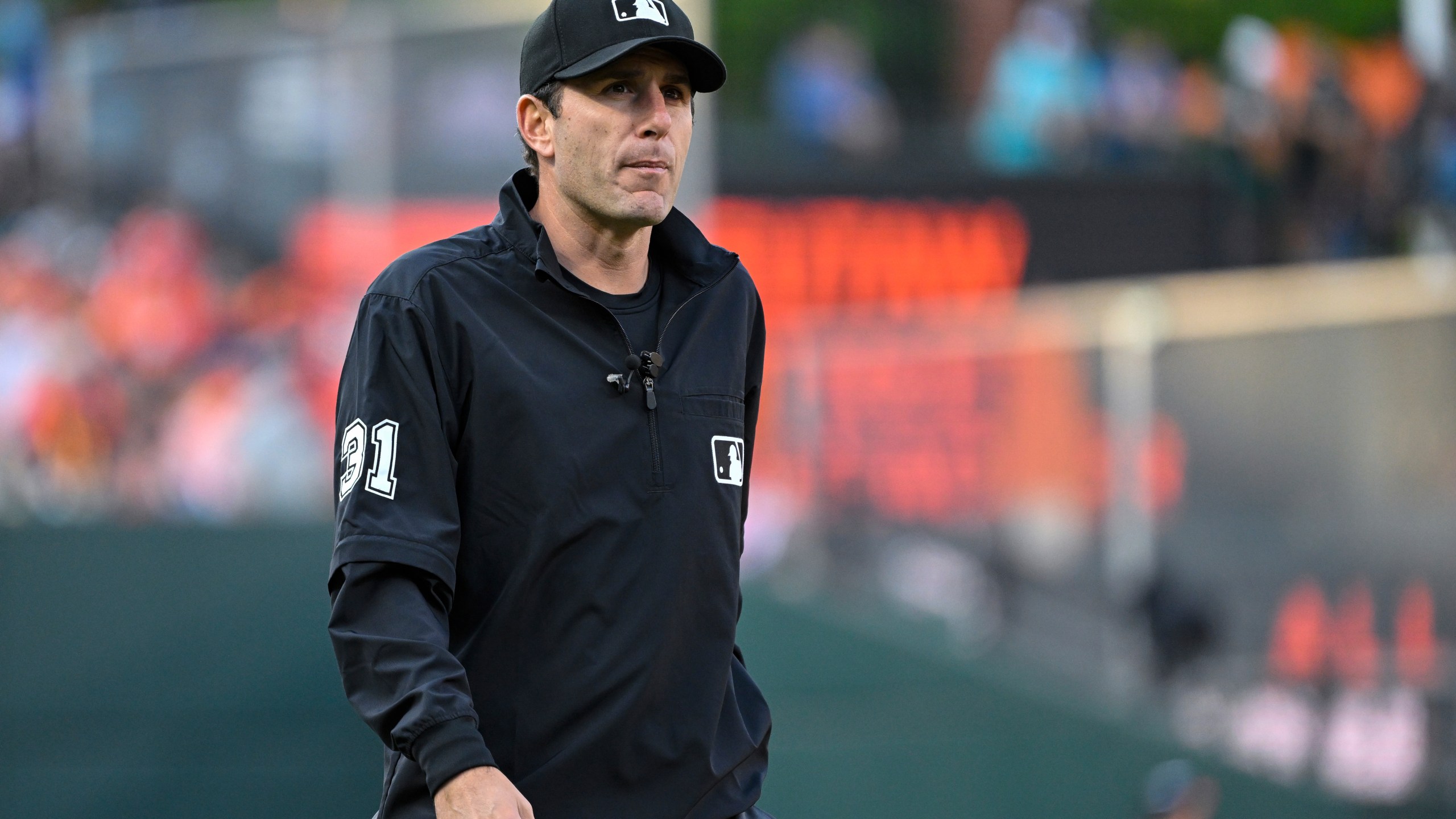 FILE - Umpire Pat Hoberg (31) looks on during a baseball game between the Baltimore Orioles and the Los Angeles Angels, May 17, 2023, in Baltimore. (AP Photo/Terrance Williams, File)