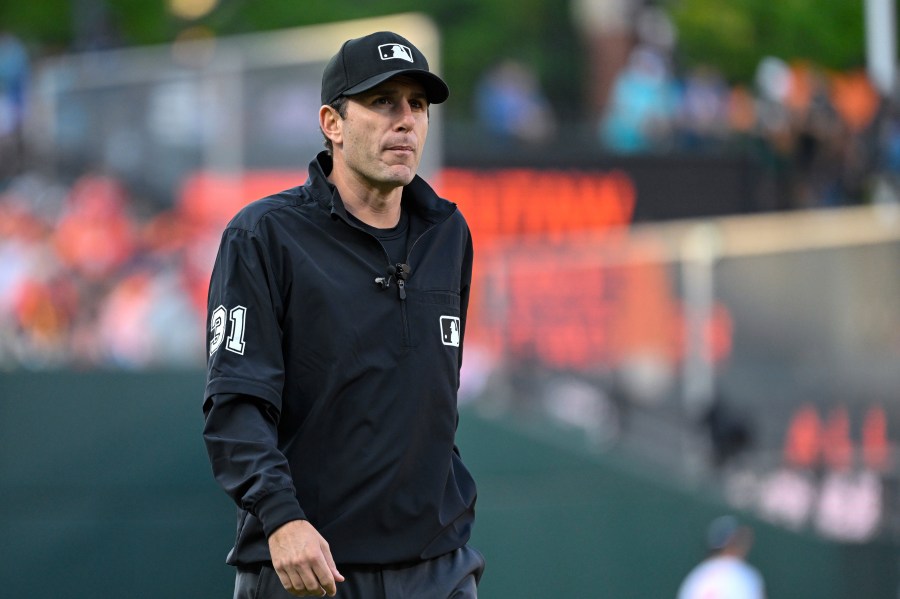 FILE - Umpire Pat Hoberg (31) looks on during a baseball game between the Baltimore Orioles and the Los Angeles Angels, May 17, 2023, in Baltimore. (AP Photo/Terrance Williams, File)