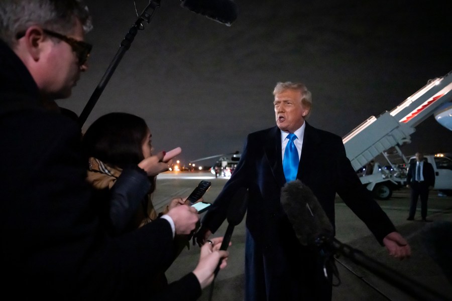 President Donald Trump speaks to reporters next to Air Force One after arriving back at Joint Base Andrews, Md., Sunday, Feb. 2, 2025. (AP Photo/Ben Curtis)