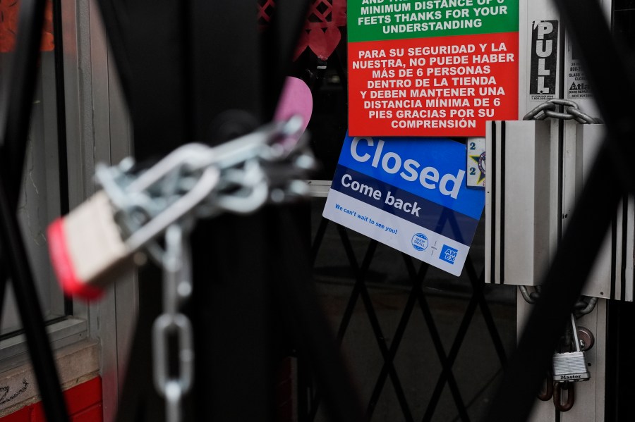 A closed sign is displayed at a mini grocery store in the Little Village neighborhood of Chicago, Monday, Feb. 3, 2025. (AP Photo/Nam Y. Huh)