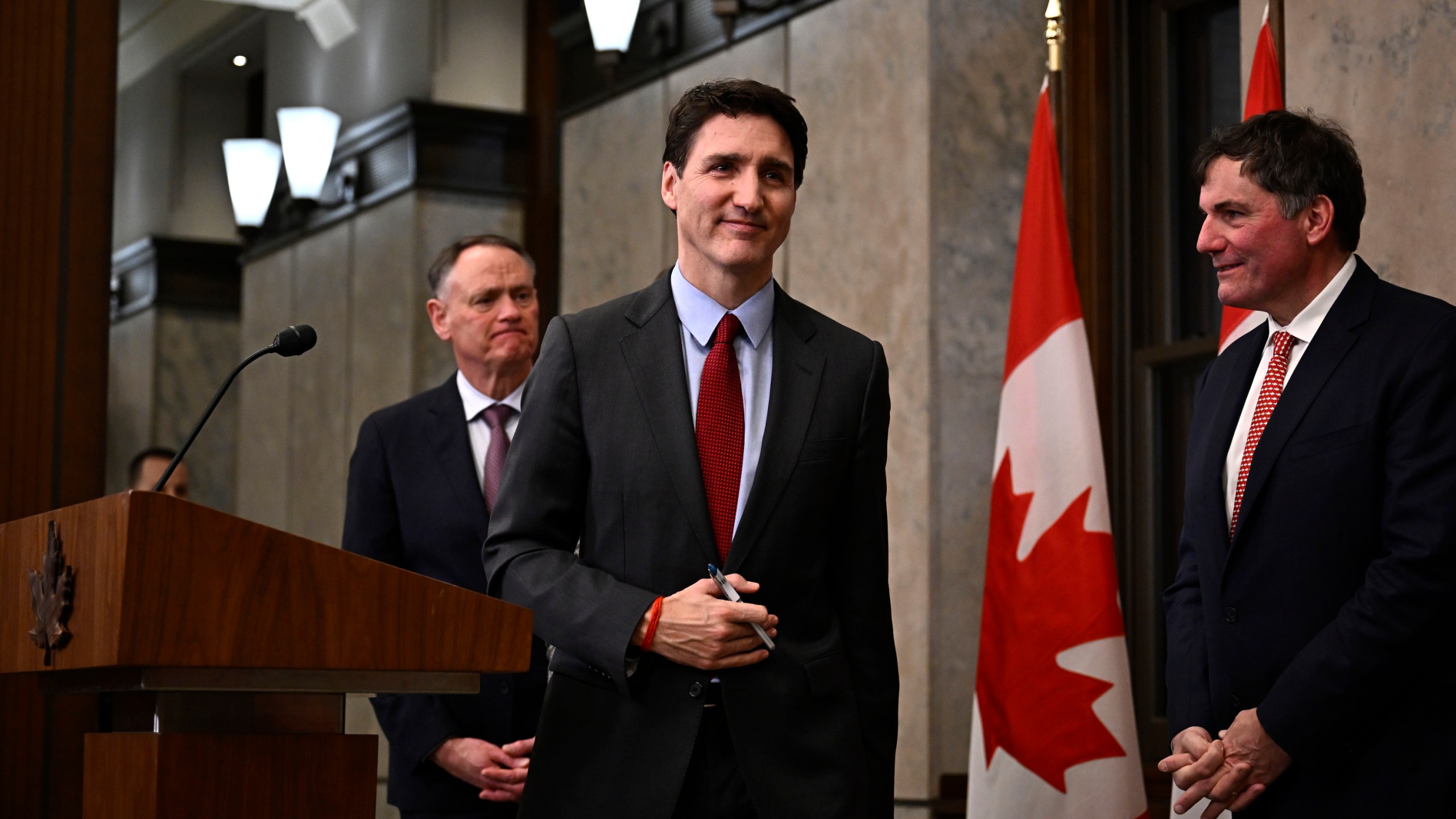 Canadian Prime Minister Justin Trudeau leaves after addressing media members following U.S. President Donald Trump's signing an order to impose stiff tariffs on imports from Mexico, Canada and China, in Ottawa, Canada, Saturday, Feb. 1, 2025. (Justin Tang/The Canadian Press via AP)