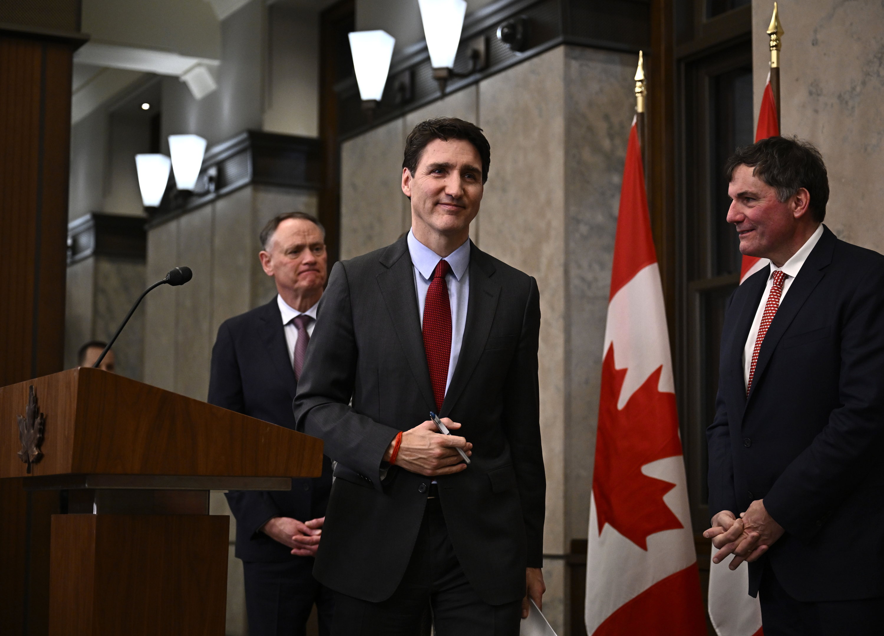 Canadian Prime Minister Justin Trudeau leaves after addressing media members following U.S. President Donald Trump's signing an order to impose stiff tariffs on imports from Mexico, Canada and China, in Ottawa, Canada, Saturday, Feb. 1, 2025. (Justin Tang/The Canadian Press via AP)