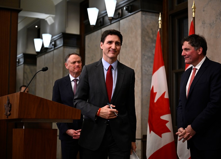 Canadian Prime Minister Justin Trudeau leaves after addressing media members following U.S. President Donald Trump's signing an order to impose stiff tariffs on imports from Mexico, Canada and China, in Ottawa, Canada, Saturday, Feb. 1, 2025. (Justin Tang/The Canadian Press via AP)