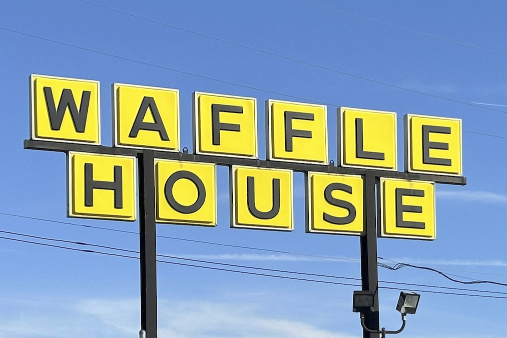 FILE - A Waffle House sign is shown in Indianapolis Feb. 19, 2024. (AP Photo/Isabella Volmert, File)