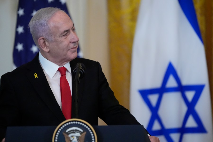 Israeli Prime Minister Benjamin Netanyahu listens as President Donald Trump speaks during a news conference in the East Room of the White House, Tuesday, Feb. 4, 2025, in Washington. (AP Photo/Alex Brandon)