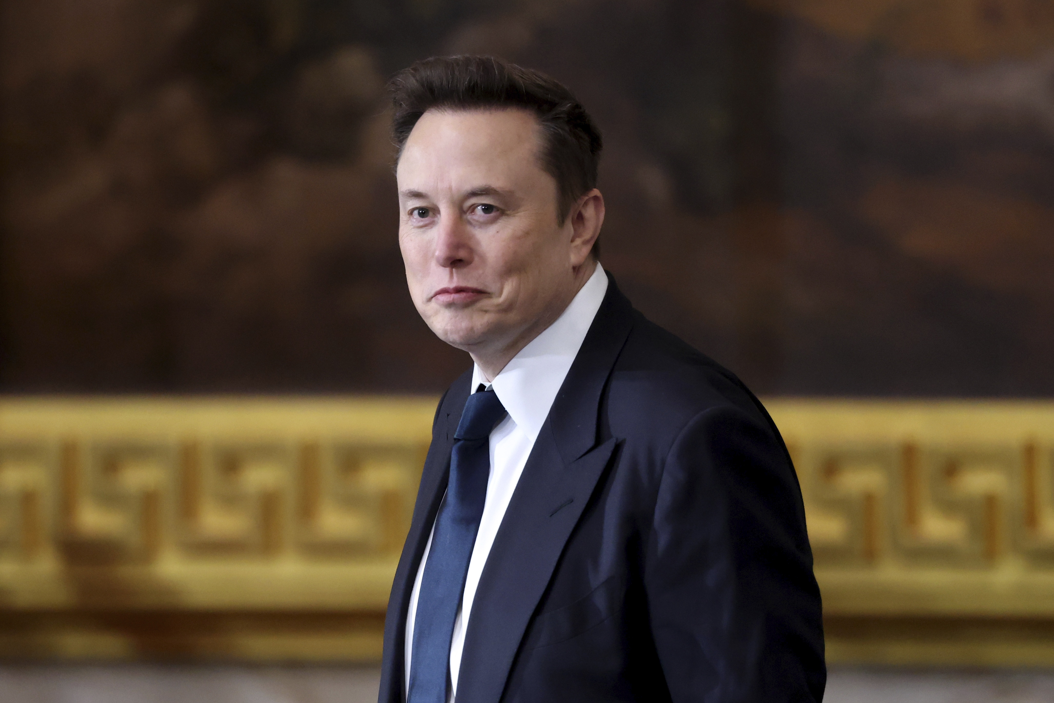 FILE - Elon Musk arrives before the 60th Presidential Inauguration in the Rotunda of the U.S. Capitol in Washington, Monday, Jan. 20, 2025. (Kevin Lamarque/Pool Photo via AP, File)