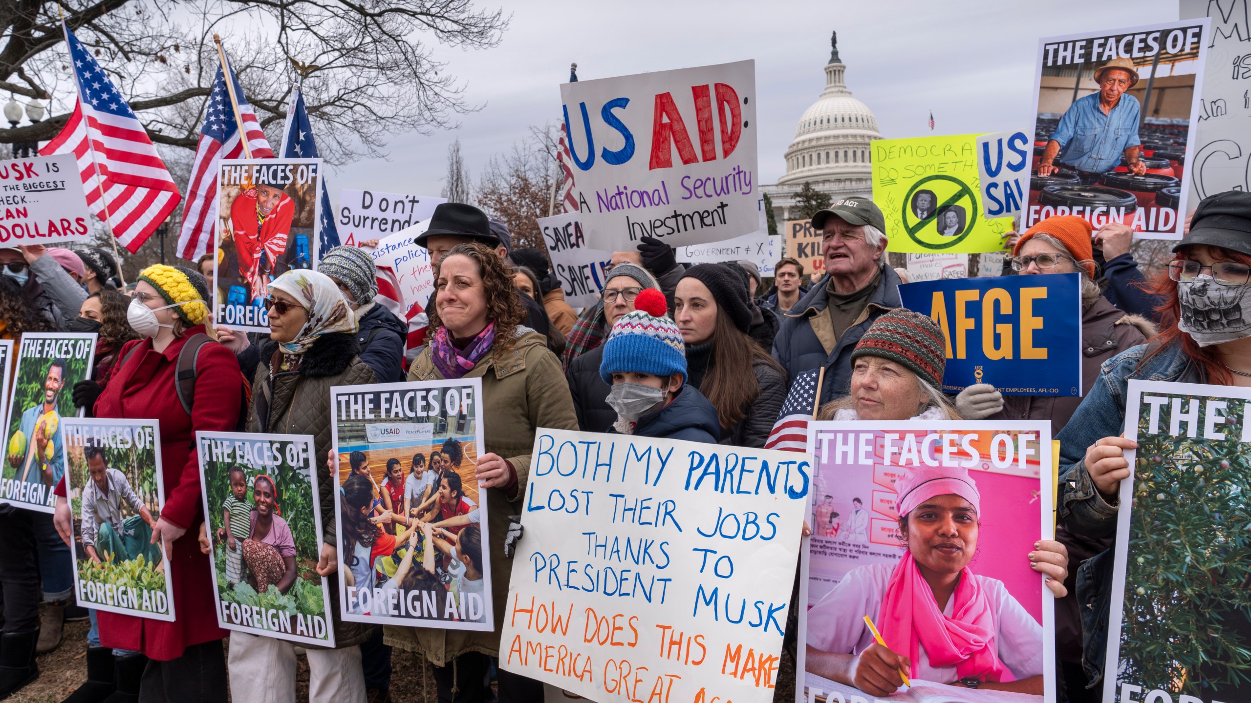 Demonstrators and lawmakers rally against President Donald Trump and his ally Elon Musk as they disrupt the federal government, including dismantling the U.S. Agency for International Development, which administers foreign aid approved by Congress, on Capitol Hill in Washington, Wednesday, Feb. 5, 2025. (AP Photo/J. Scott Applewhite)