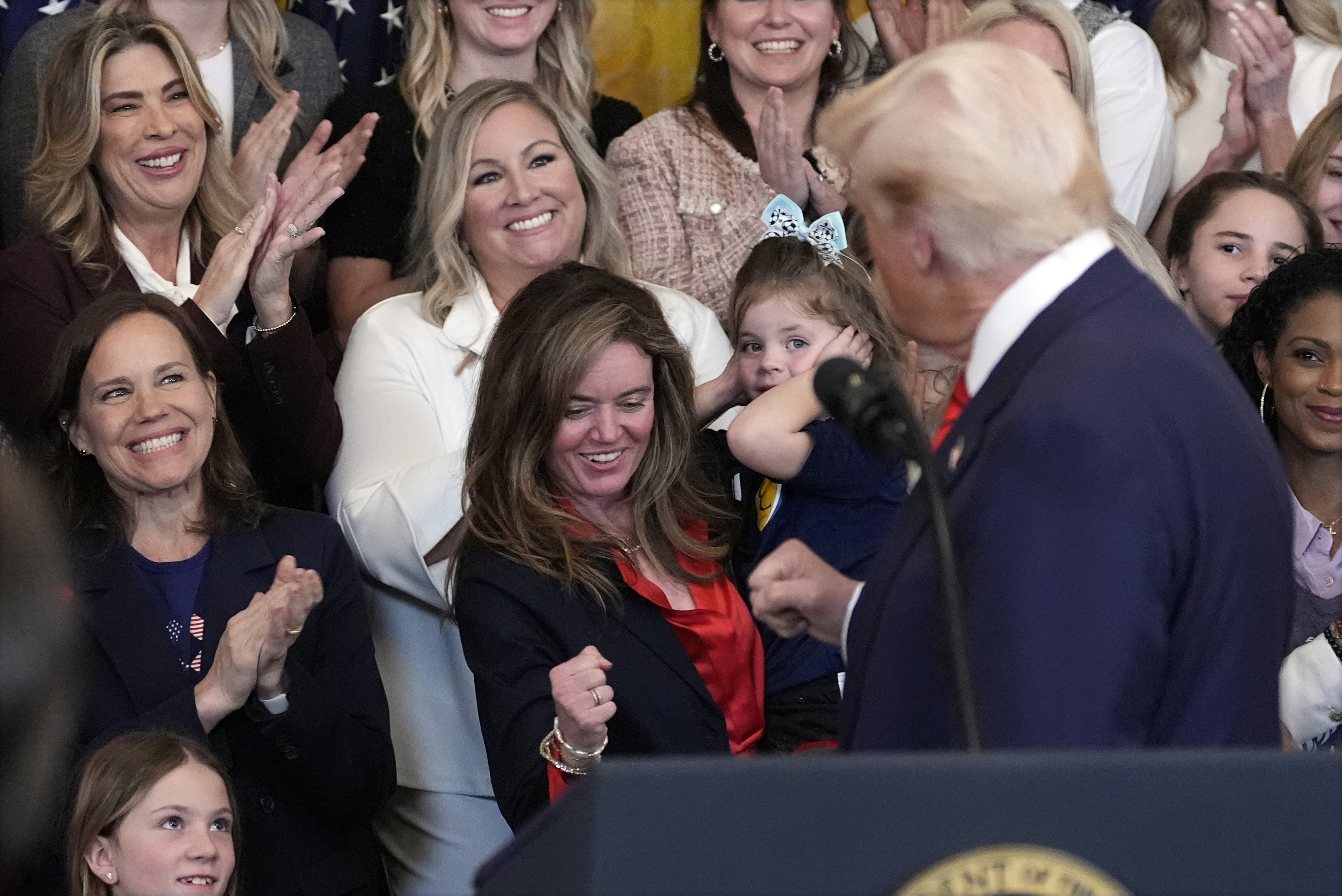 President Donald Trump gestures as he speaks before signing an executive order barring transgender female athletes from competing in women's or girls' sporting events, in the East Room of the White House, Wednesday, Feb. 5, 2025, in Washington. (AP Photo/Alex Brandon)