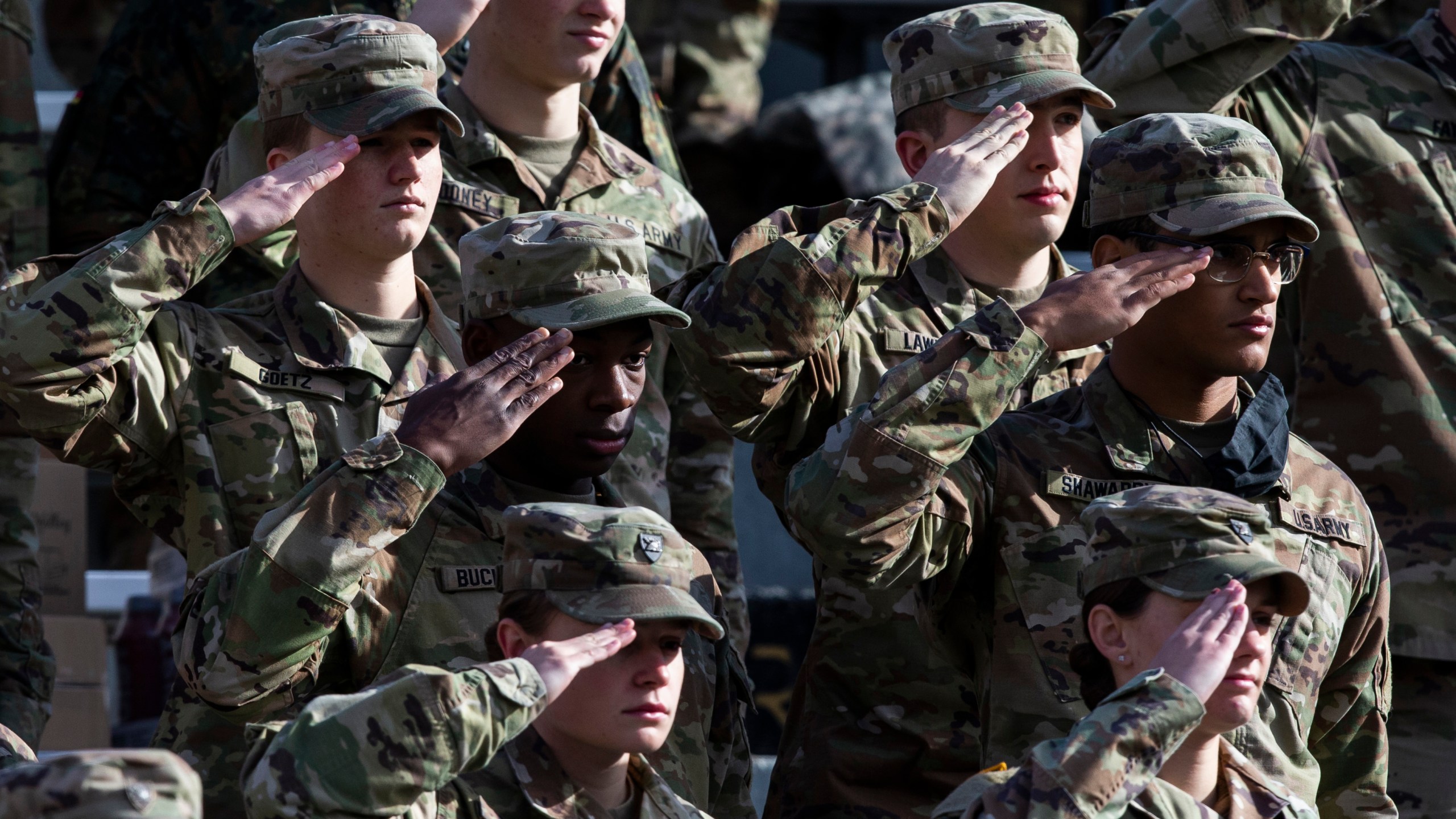 FILE - West Point cadets salute during the National Anthem prior to the NCAA college football game between the Army Black Knights and Massachusetts at Michie Stadium, Saturday, Nov. 20, 2021, in West Point, N.Y. (AP Photo/Eduardo Munoz Alvarez, File)