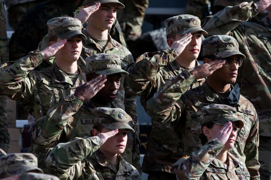 FILE - West Point cadets salute during the National Anthem prior to the NCAA college football game between the Army Black Knights and Massachusetts at Michie Stadium, Saturday, Nov. 20, 2021, in West Point, N.Y. (AP Photo/Eduardo Munoz Alvarez, File)