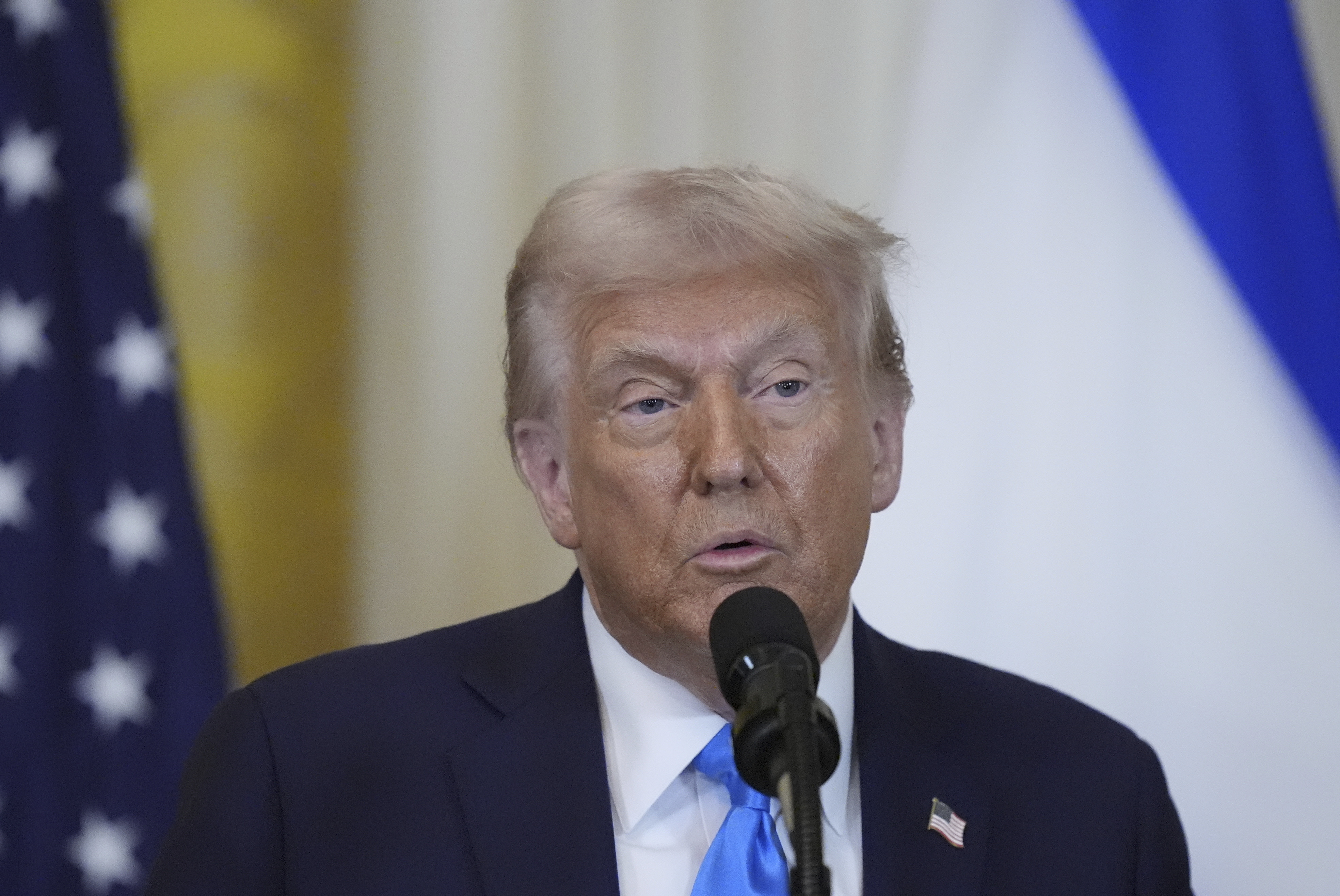 President Donald Trump speaks with Israeli Prime Minister Benjamin Netanyahu during a news conference in the East Room of the White House, Tuesday, Feb. 4, 2025, in Washington. (AP Photo/Alex Brandon)