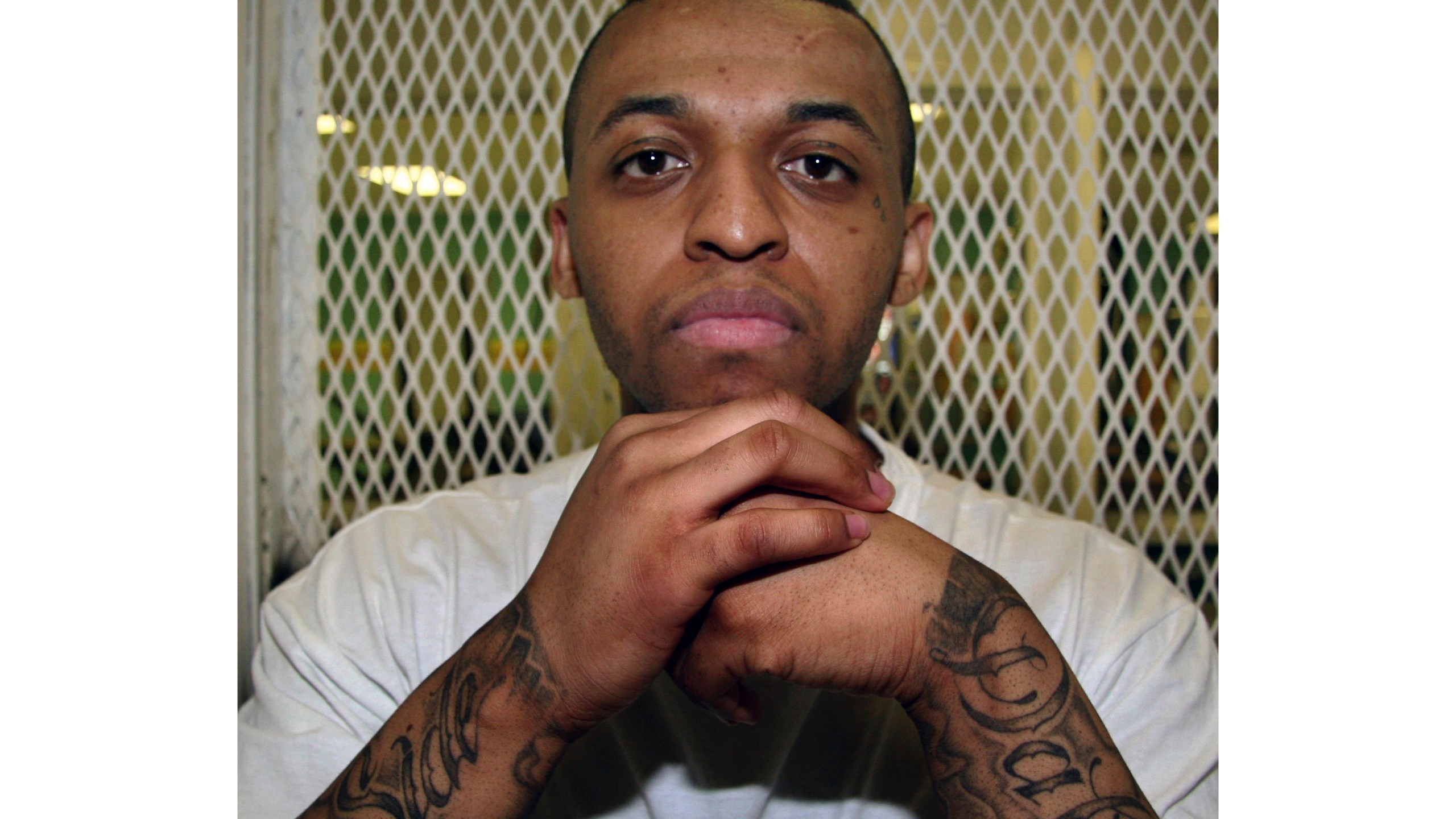 FILE - Texas death row inmate Steven Lawayne Nelson poses for a photo in a visiting cage at the Texas Department of Criminal Justice Polunsky Unit outside Livingston, Texas, on Dec. 5, 2012. (AP Photo/Michael Graczyk, File)