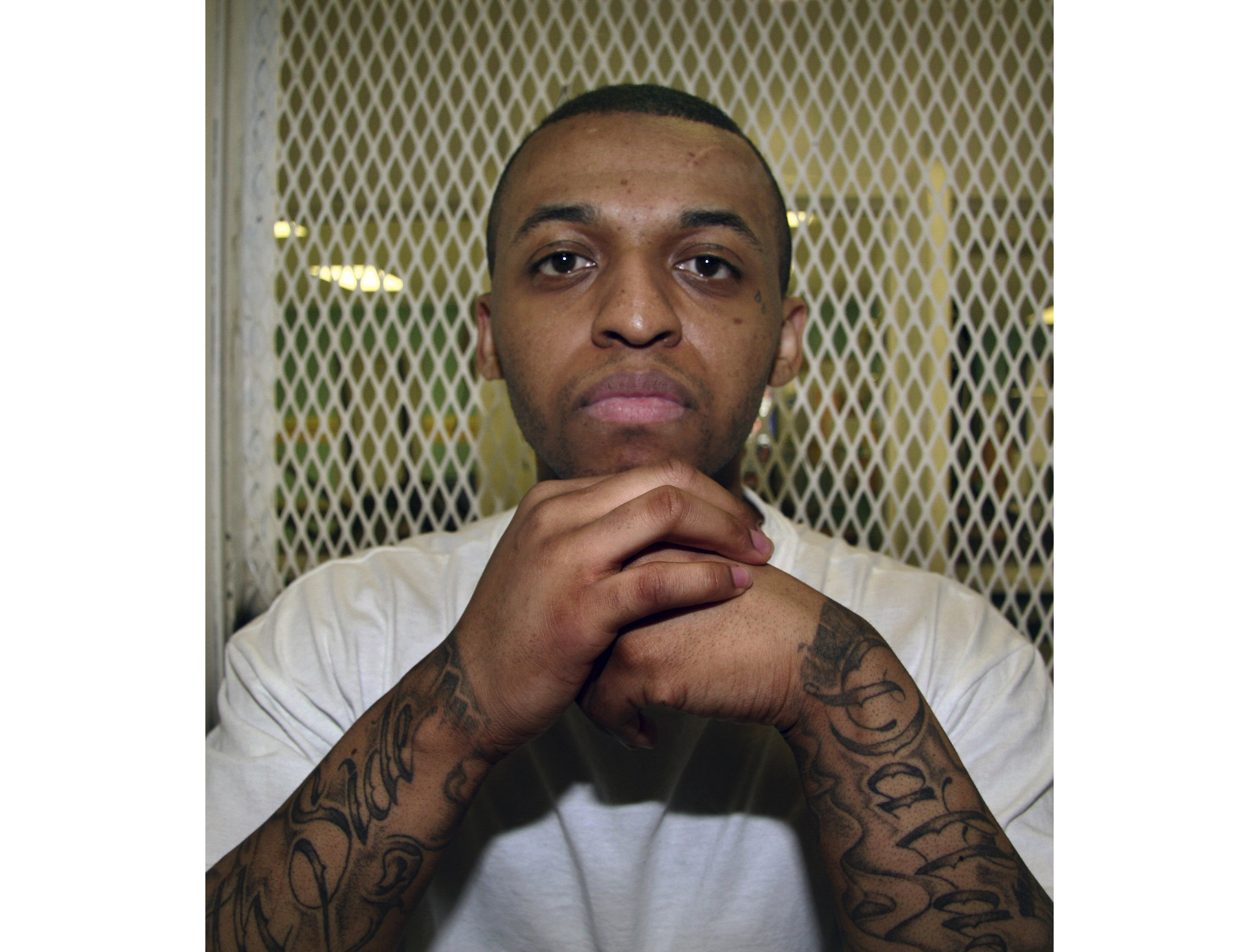 FILE - Texas death row inmate Steven Lawayne Nelson poses for a photo in a visiting cage at the Texas Department of Criminal Justice Polunsky Unit outside Livingston, Texas, on Dec. 5, 2012. (AP Photo/Michael Graczyk, File)