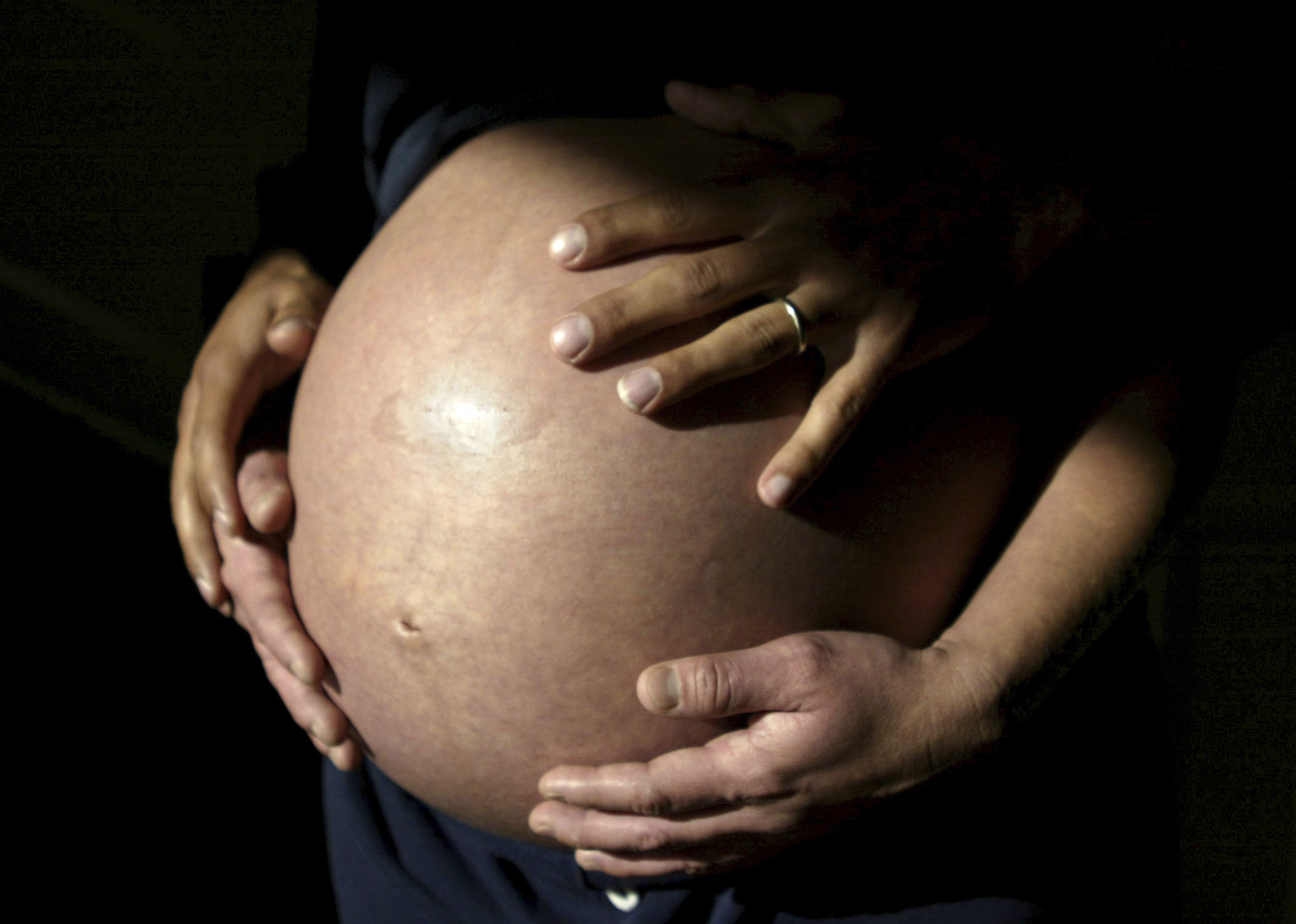 FILE - A couple awaits the arrival of their first child in Carlsbad, Calif., in November 2005. (AP Photo/Julie Busch, File)