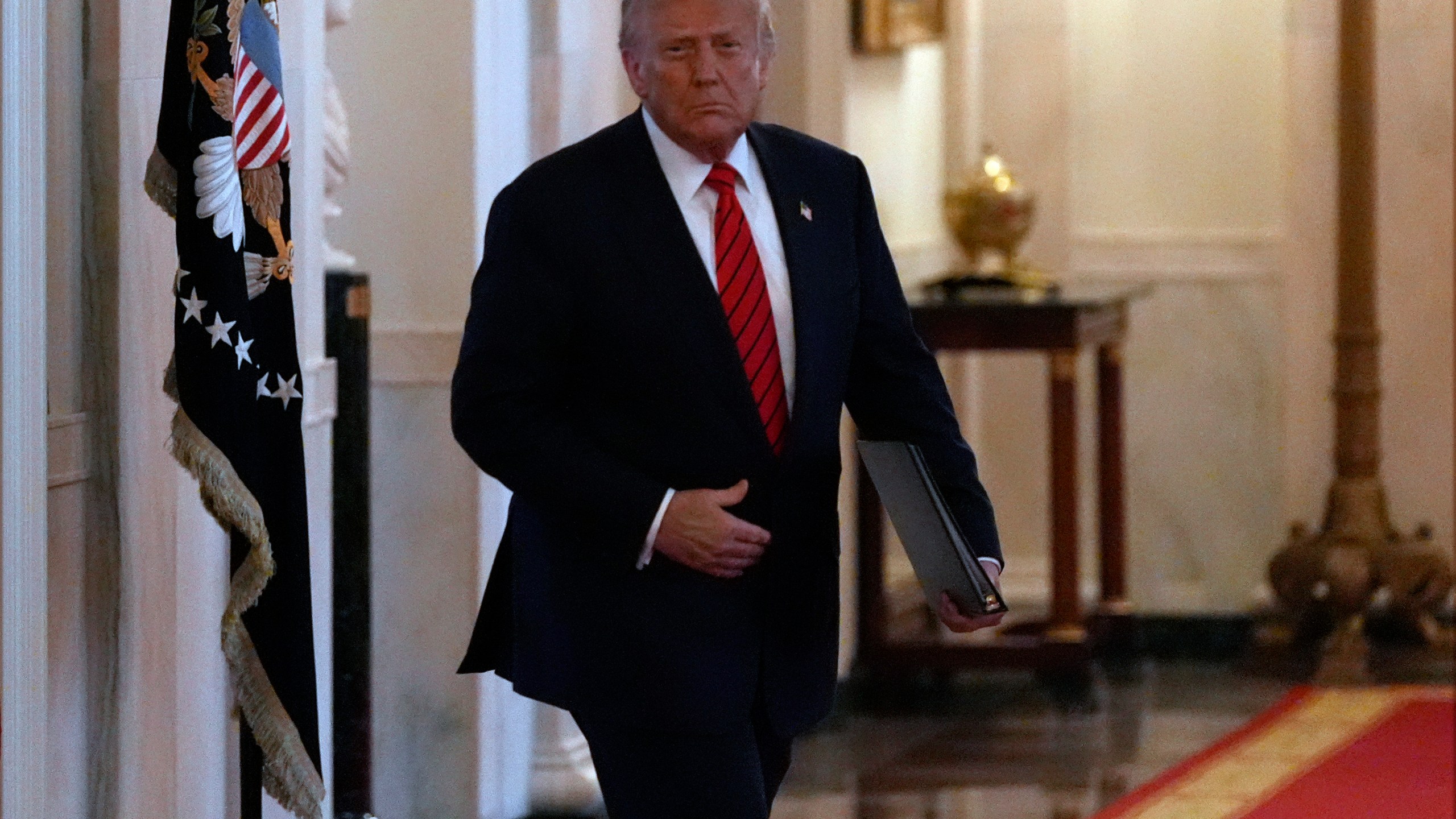 President Donald Trump arrives before signing an executive order barring transgender female athletes from competing in women's or girls' sporting events, in the East Room of the White House, Wednesday, Feb. 5, 2025, in Washington. (AP Photo/Alex Brandon)