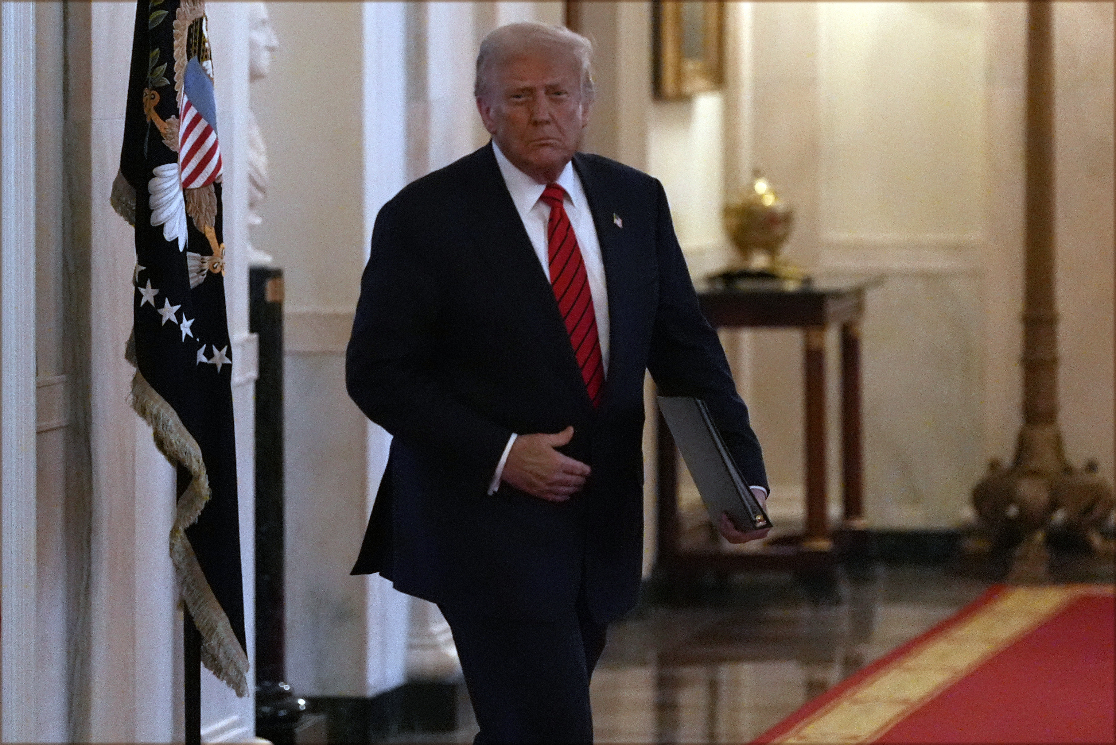 President Donald Trump arrives before signing an executive order barring transgender female athletes from competing in women's or girls' sporting events, in the East Room of the White House, Wednesday, Feb. 5, 2025, in Washington. (AP Photo/Alex Brandon)