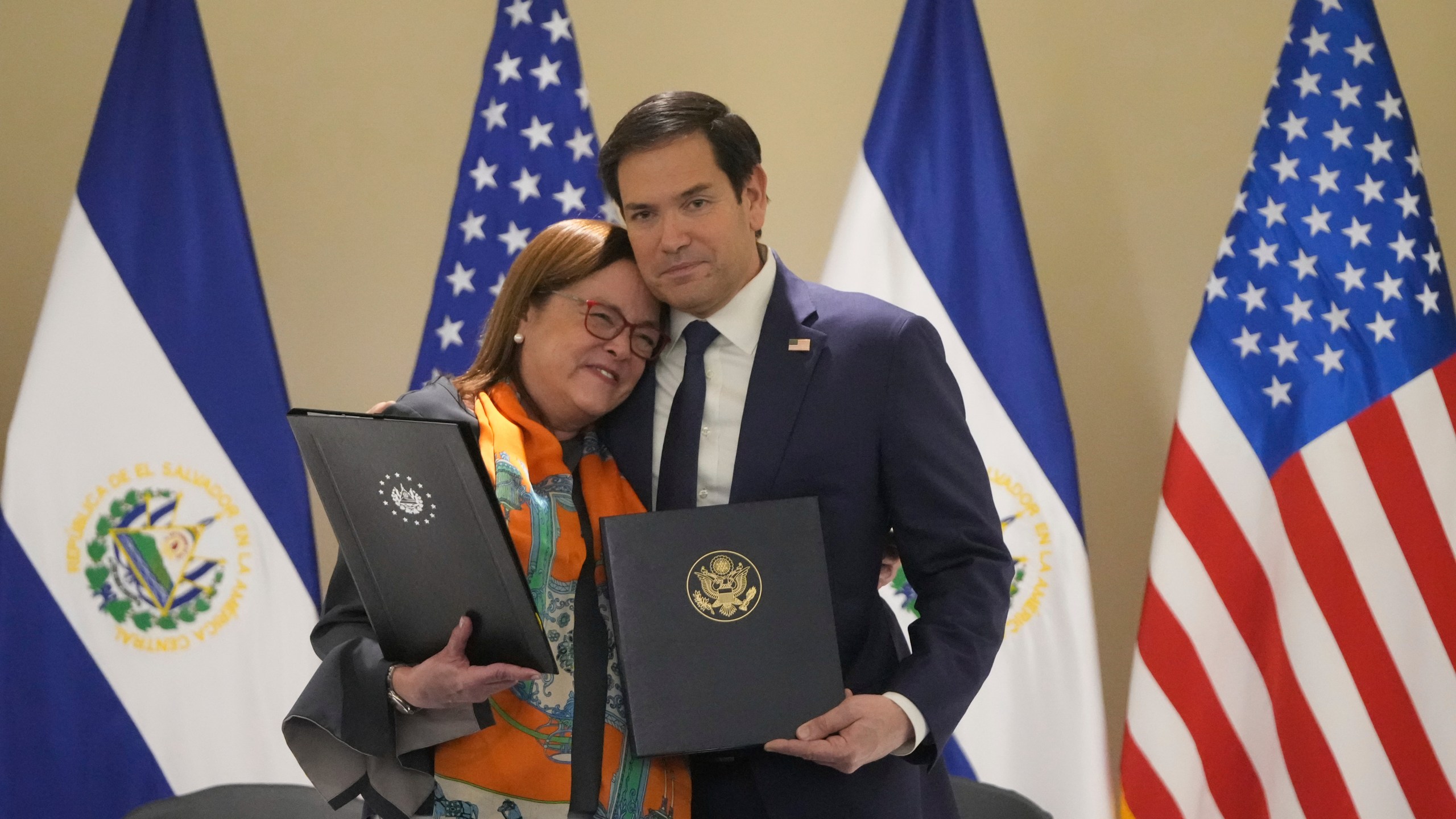 U.S. Secretary of State Marco Rubio, right, and El Salvador's Foreign Minister Alexandra Hill Tinoco pose for a photo after signing a memorandum of understanding regarding civil nuclear cooperation between their countries at the Intercontinental Real Hotel in San Salvador, El Salvador, Monday, Feb. 3, 2025. (AP Photo/Mark Schiefelbein, Pool)