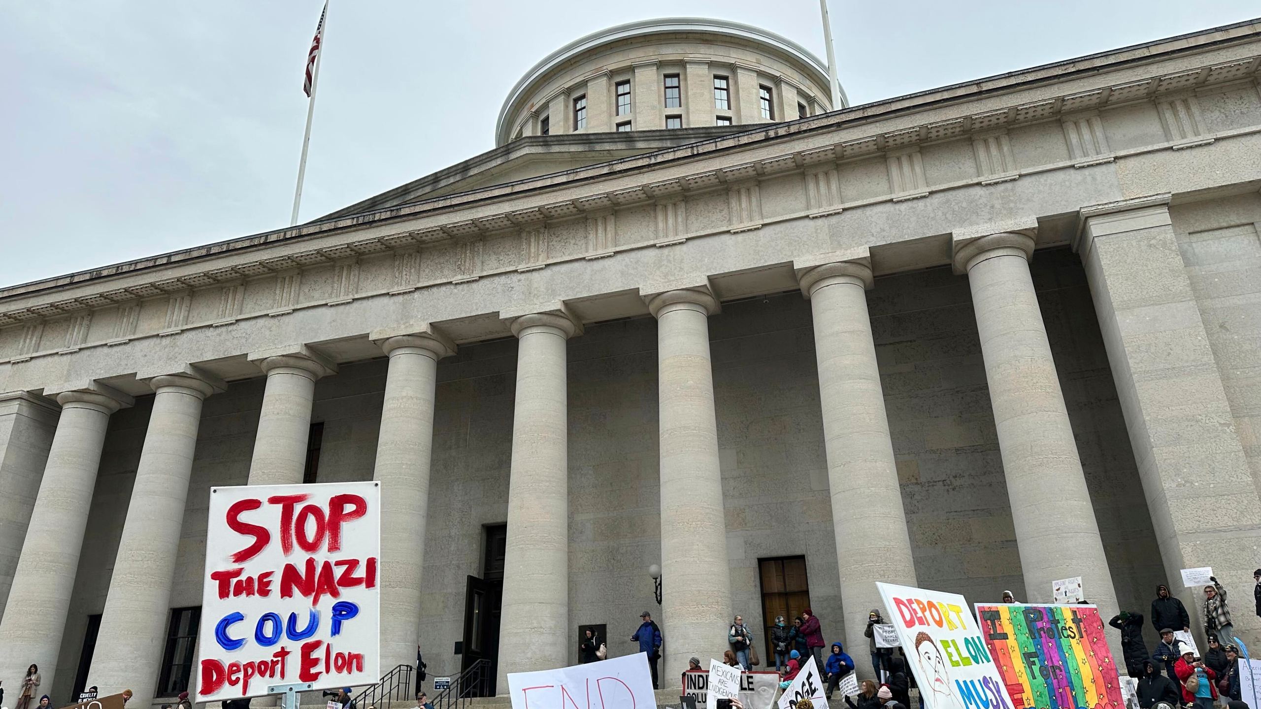 Protesters gather at the Ohio Statehouse in Columbus, Ohio, to demonstrate against the actions of Republican President Donald Trump and billionaire ally Elon Musk. (AP Photo/Julie Carr Smyth)