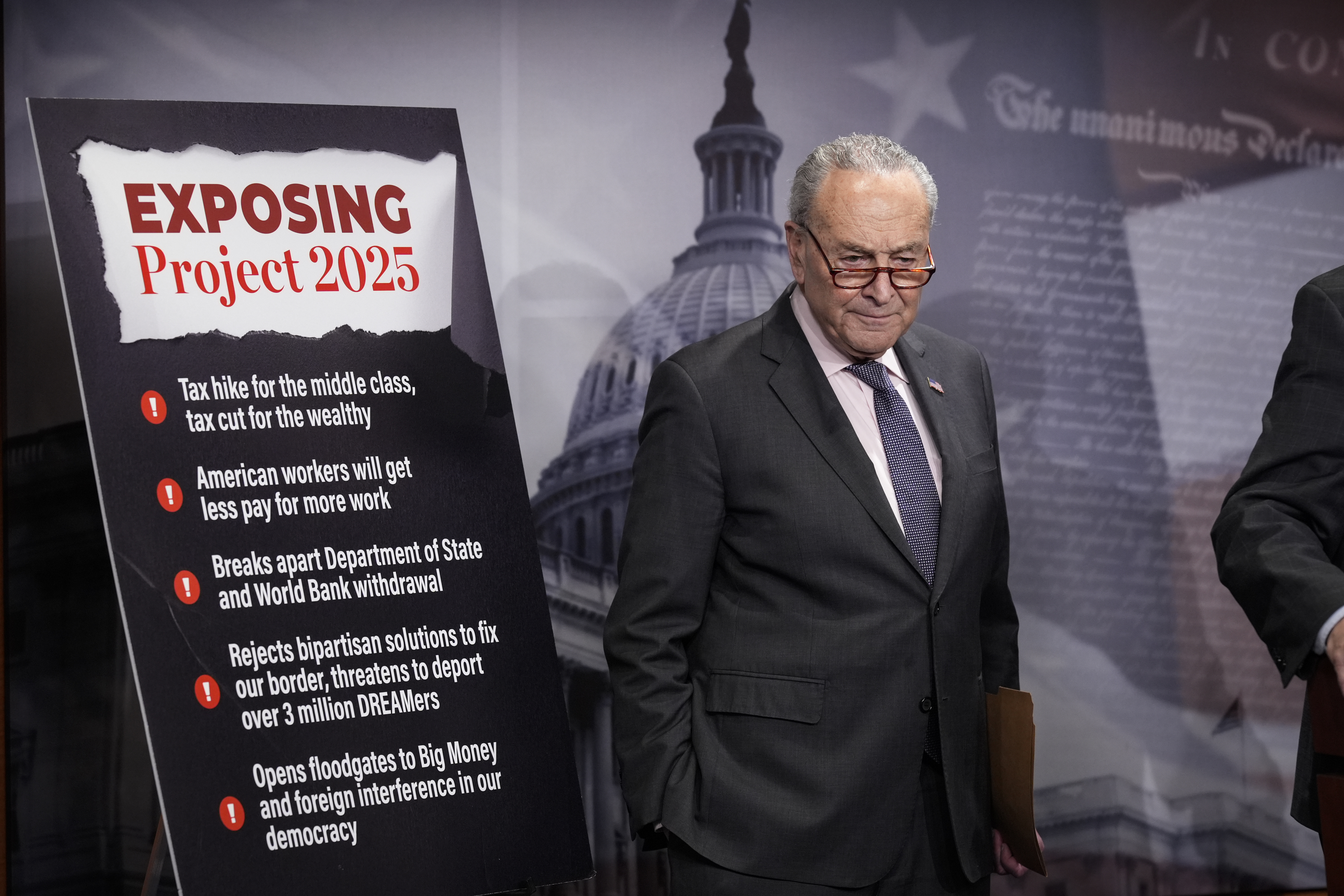 Senate Minority Leader Chuck Schumer, D-N.Y., joined by members of the Senate Budget Committee, criticizes Russ Vought, an author of the conservative handbook Project 2025 and President Donald Trump's pick to run the Office of Management and Budget, at a news conference at the Capitol in Washington, Thursday, Jan. 23, 2025. (AP Photo/J. Scott Applewhite)