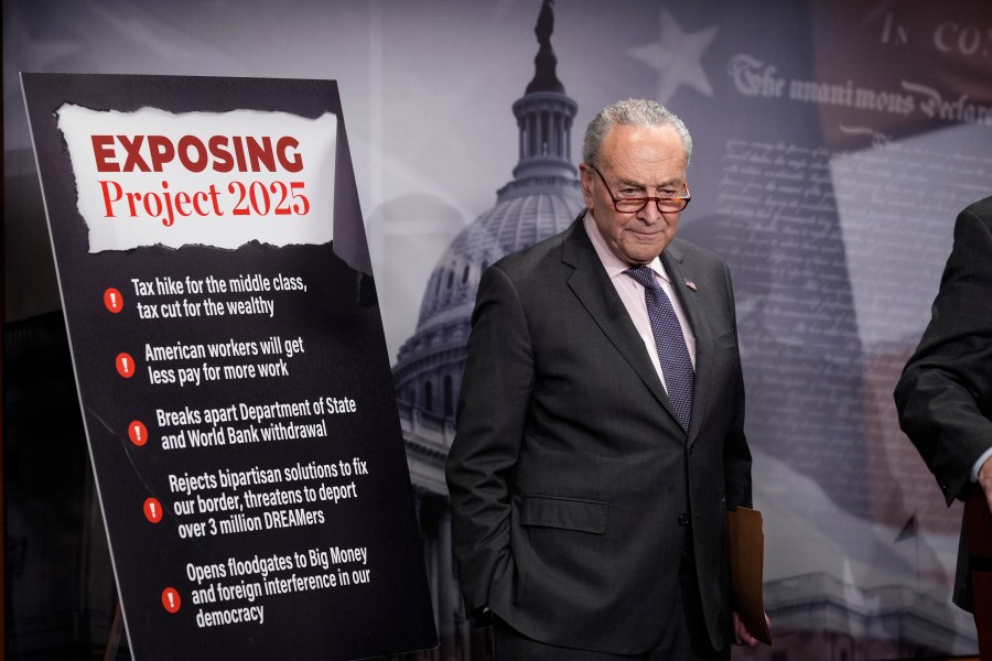 Senate Minority Leader Chuck Schumer, D-N.Y., joined by members of the Senate Budget Committee, criticizes Russ Vought, an author of the conservative handbook Project 2025 and President Donald Trump's pick to run the Office of Management and Budget, at a news conference at the Capitol in Washington, Thursday, Jan. 23, 2025. (AP Photo/J. Scott Applewhite)