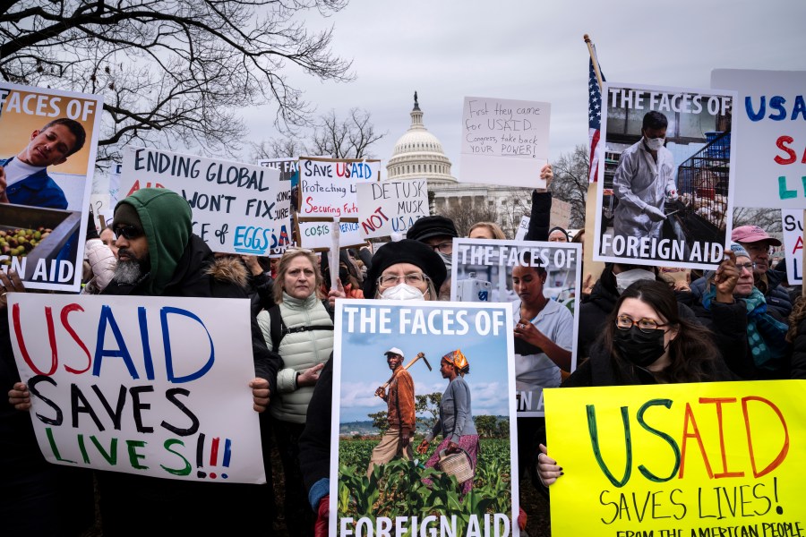 Demonstrators and lawmakers rally against President Donald Trump and his ally Elon Musk as they disrupt the federal government, including dismantling the U.S. Agency for International Development, which administers foreign aid approved by Congress, on Capitol Hill in Washington, Wednesday, Feb. 5, 2025. (AP Photo/J. Scott Applewhite)