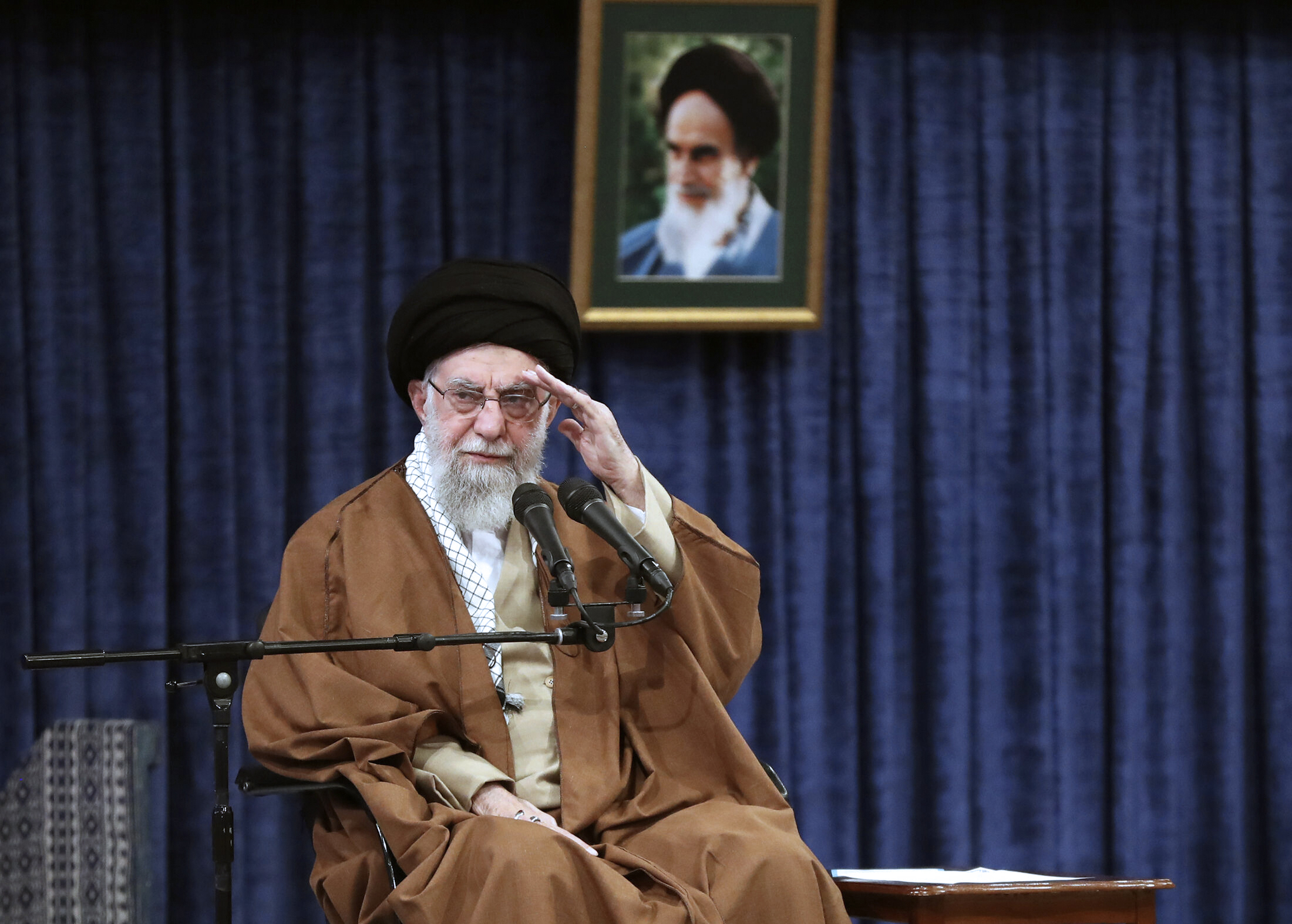 In this photo released by an official website of the office of the Iranian supreme leader, Supreme Leader Ayatollah Ali Khamenei salutes in a meeting with a group of air force officers in Tehran, Iran, Friday, Feb. 7, 2025. (Office of the Iranian Supreme Leader via AP)