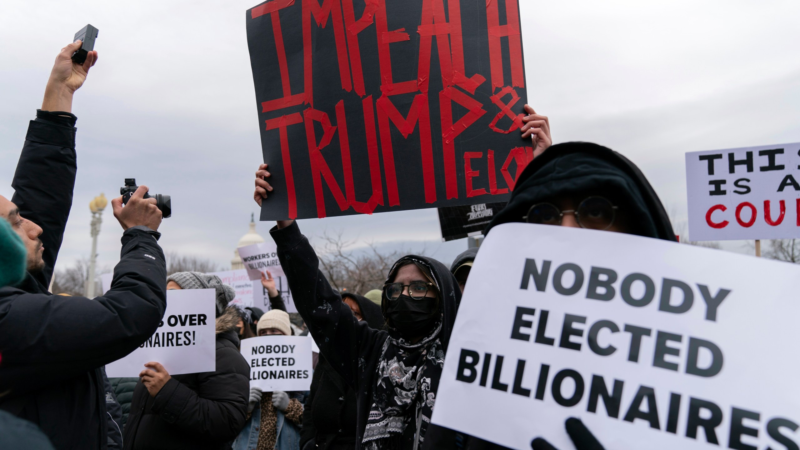 FILE - People protest against Elon Musk outside the U.S. Department of Labor in Washington, Wednesday, Feb. 5, 2025. (AP Photo/Jose Luis Magana, File)