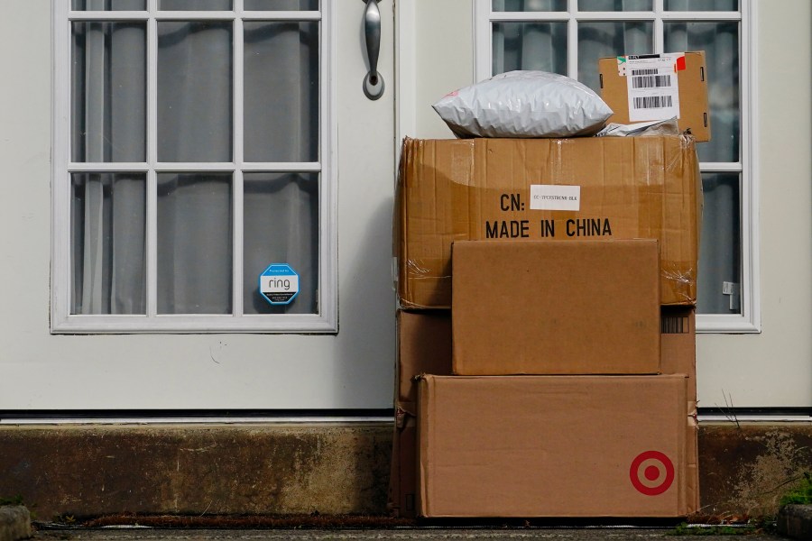 FILE - Packages are seen stacked on the doorstep of a residence, Wednesday, Oct. 27, 2021, in Upper Darby, Pa. (AP Photo/Matt Slocum, File)