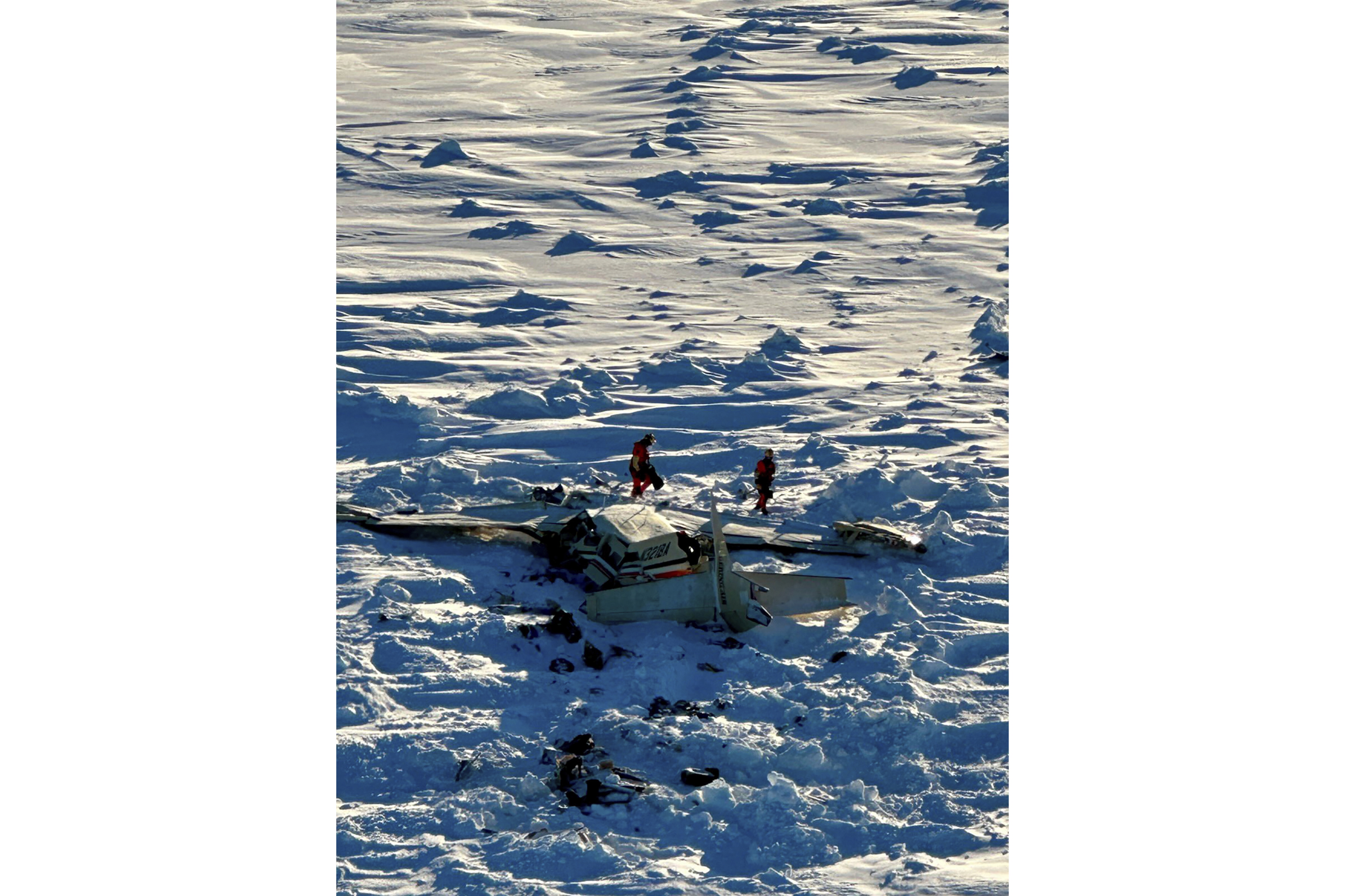 This photo provided by the U.S. Coast Guard on Friday, Feb. 7, 2025, shows a small commuter plane that crashed in western Alaska on a flight that was bound for the hub community of Nome. (U.S. Coast Guard via AP)