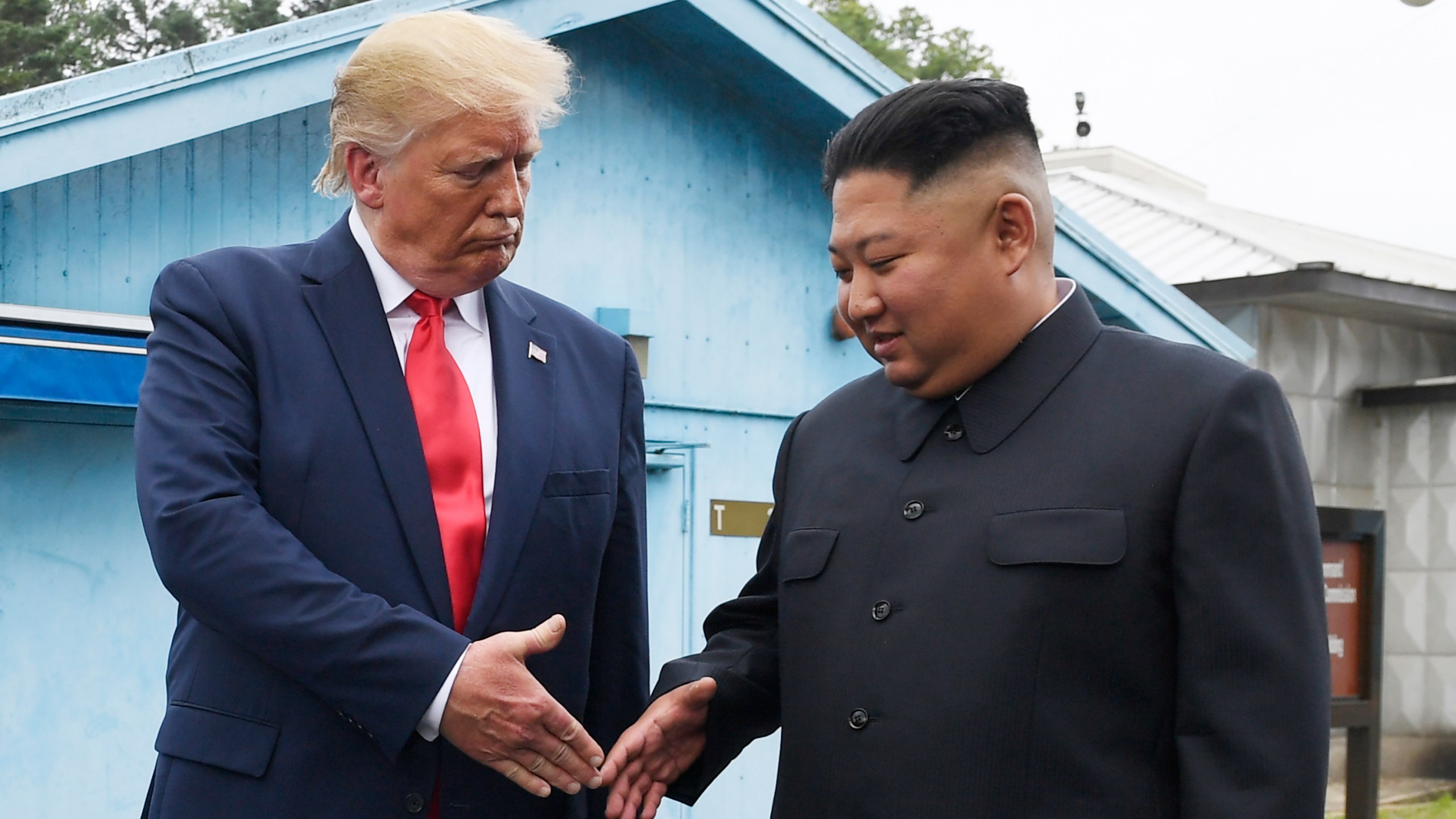 FILE - North Korean leader Kim Jong Un, right, and U.S. President Donald Trump shake hands at the border village of Panmunjom in the Demilitarized Zone on June 30, 2019. (AP Photo/Susan Walsh, File)