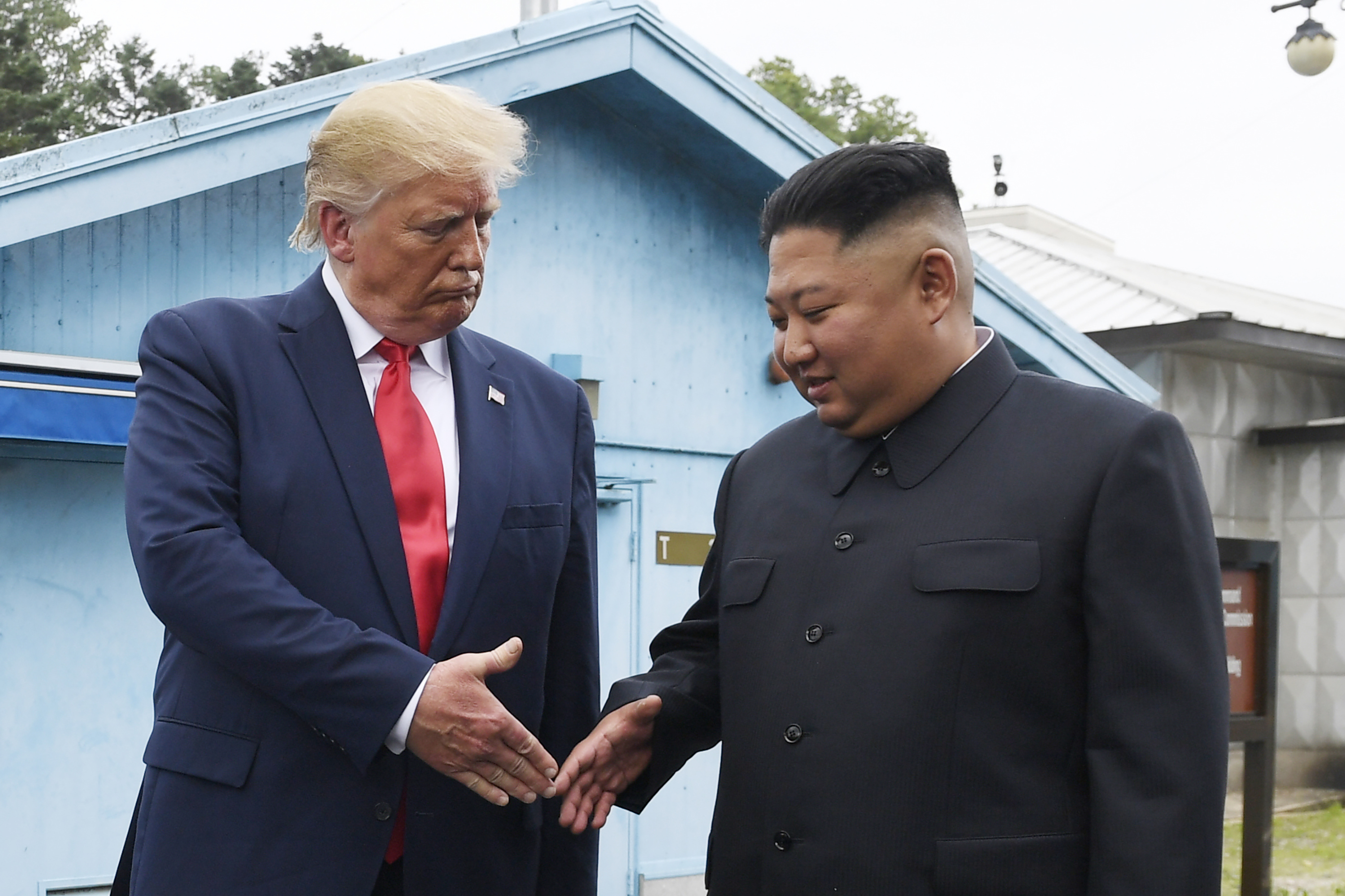 FILE - North Korean leader Kim Jong Un, right, and U.S. President Donald Trump shake hands at the border village of Panmunjom in the Demilitarized Zone on June 30, 2019. (AP Photo/Susan Walsh, File)