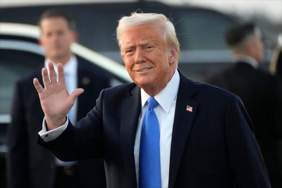 President Donald Trump waves after arriving on Air Force One at Palm Beach International Airport in West Palm Beach, Fla., Friday, Feb. 7, 2025. (AP Photo/Ben Curtis)