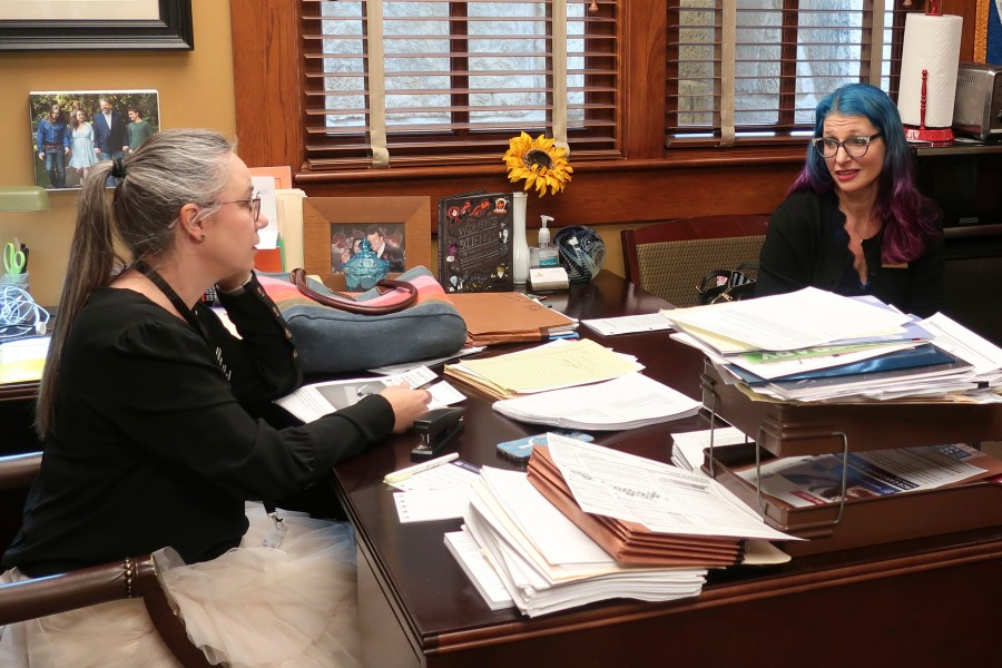 Elise Flatland, right, an Olathe, Kansas, mother with two transgender children, meets with state Rep. Nikki McDonald, D-Olathe, to help her in opposing efforts to roll back transgender rights, Wednesday, Jan. 29, 2025, at the Statehouse in Topeka, Kan. (AP Photo/John Hanna)