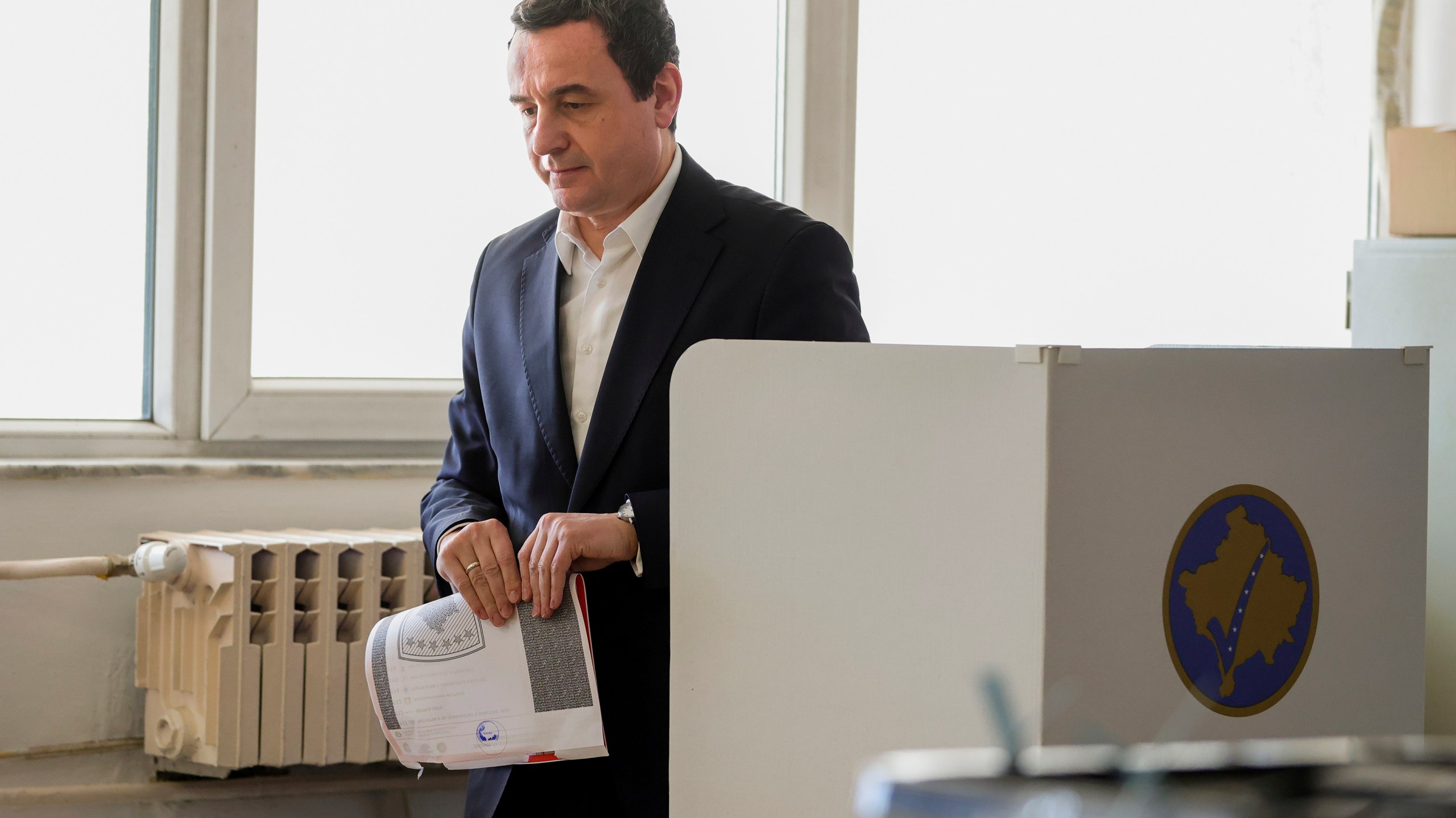 Albin Kurti, President of the left-wing Vetevendosje! party, prepares to cast his ballot as Kosovo holds a parliamentary election in Pristina, Kosovo, Sunday, Feb. 9, 2025. (AP Photo/Vlasov Sulaj)