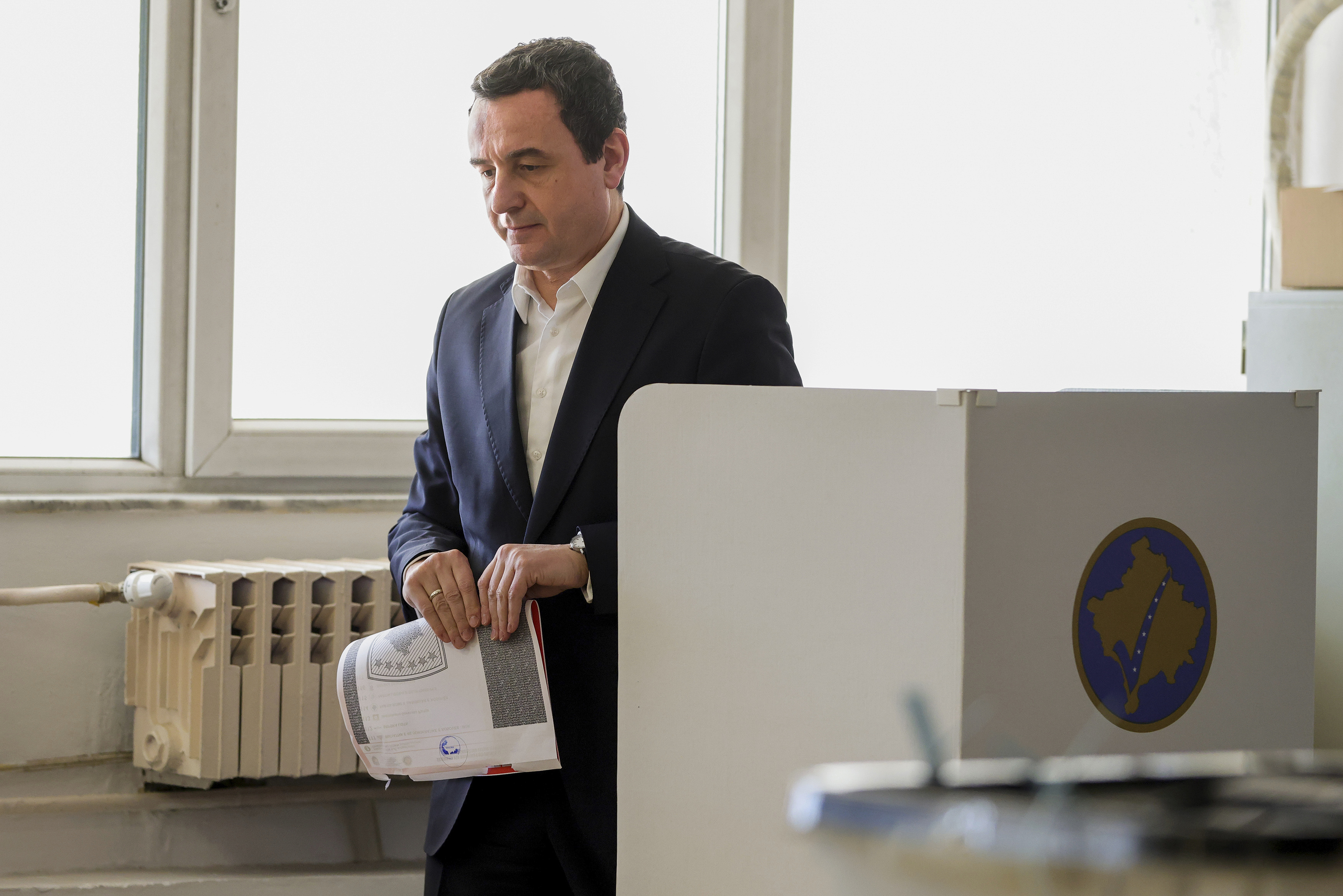 Albin Kurti, President of the left-wing Vetevendosje! party, prepares to cast his ballot as Kosovo holds a parliamentary election in Pristina, Kosovo, Sunday, Feb. 9, 2025. (AP Photo/Vlasov Sulaj)