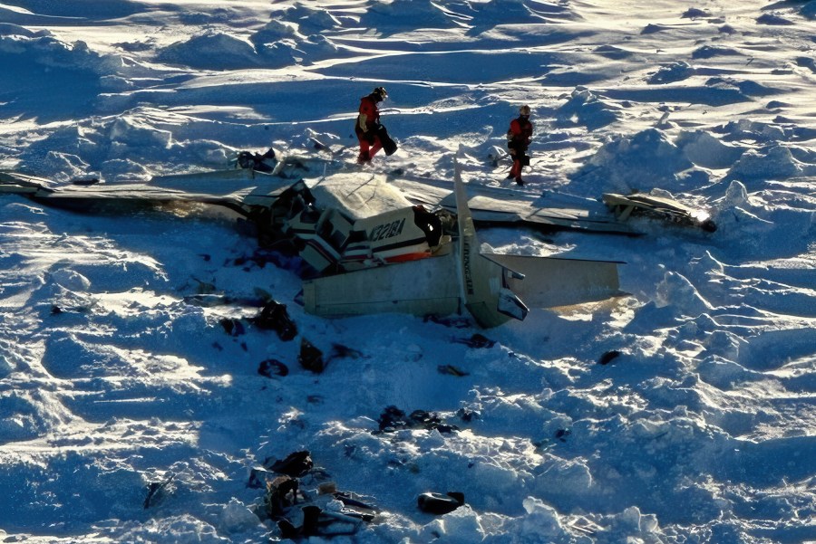 This photo provided by the U.S. Coast Guard on Friday, Feb. 7, 2025, shows a small commuter plane that crashed in western Alaska on a flight that was bound for the hub community of Nome. (U.S. Coast Guard via AP)