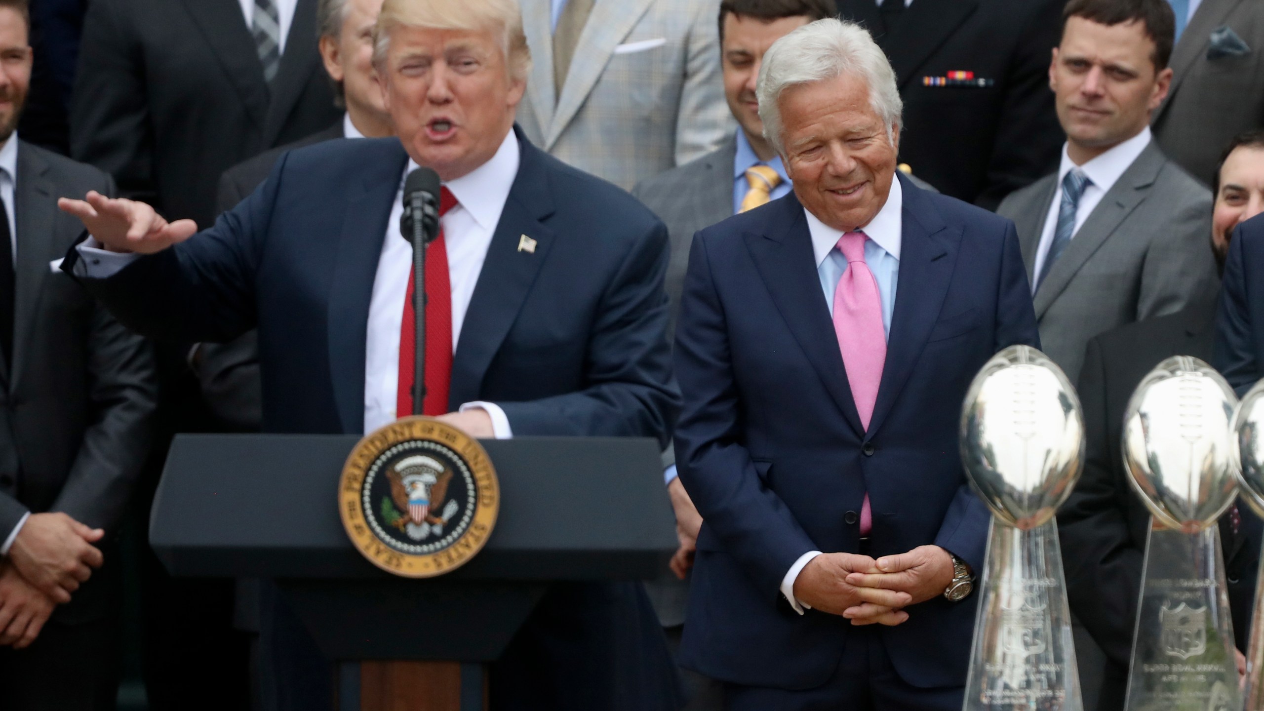 FILE - New England Patriots owner Robert Kraft, right, listen as President Donald Trump speaks during a ceremony on the South Lawn of the White House in Washington, April 19, 2017, where the president honored the Super Bowl Champion New England Patriots for their Super Bowl LI victory. (AP Photo/Andrew Harnik, File)