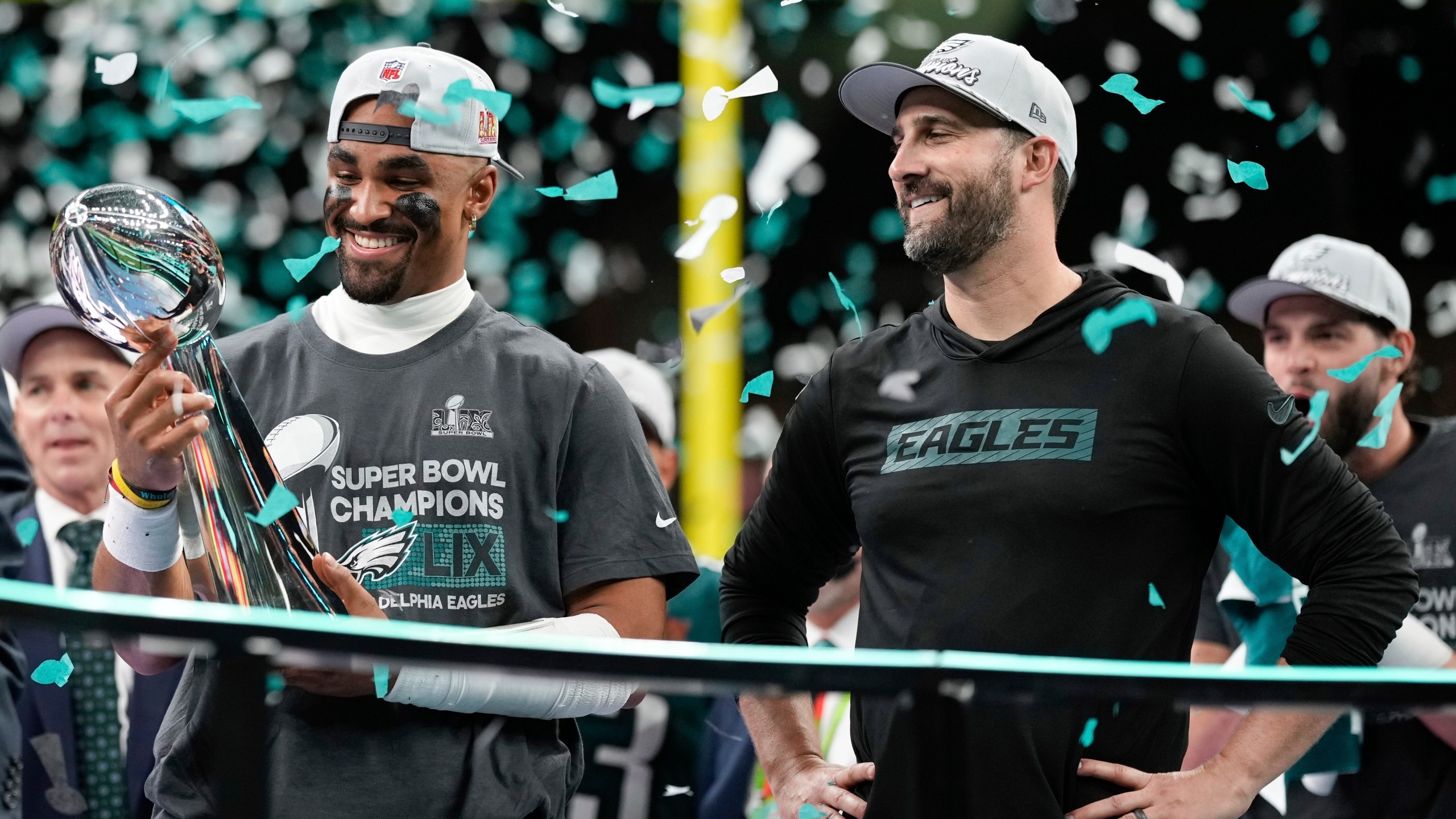 Philadelphia Eagles quarterback Jalen Hurts, left, holds the Vince Lombardi Trophy next to head coach Nick Sirianni after defeating the Kansas City Chiefs in the NFL Super Bowl 59 football game, Sunday, Feb. 9, 2025, in New Orleans. (AP Photo/Matt Slocum)